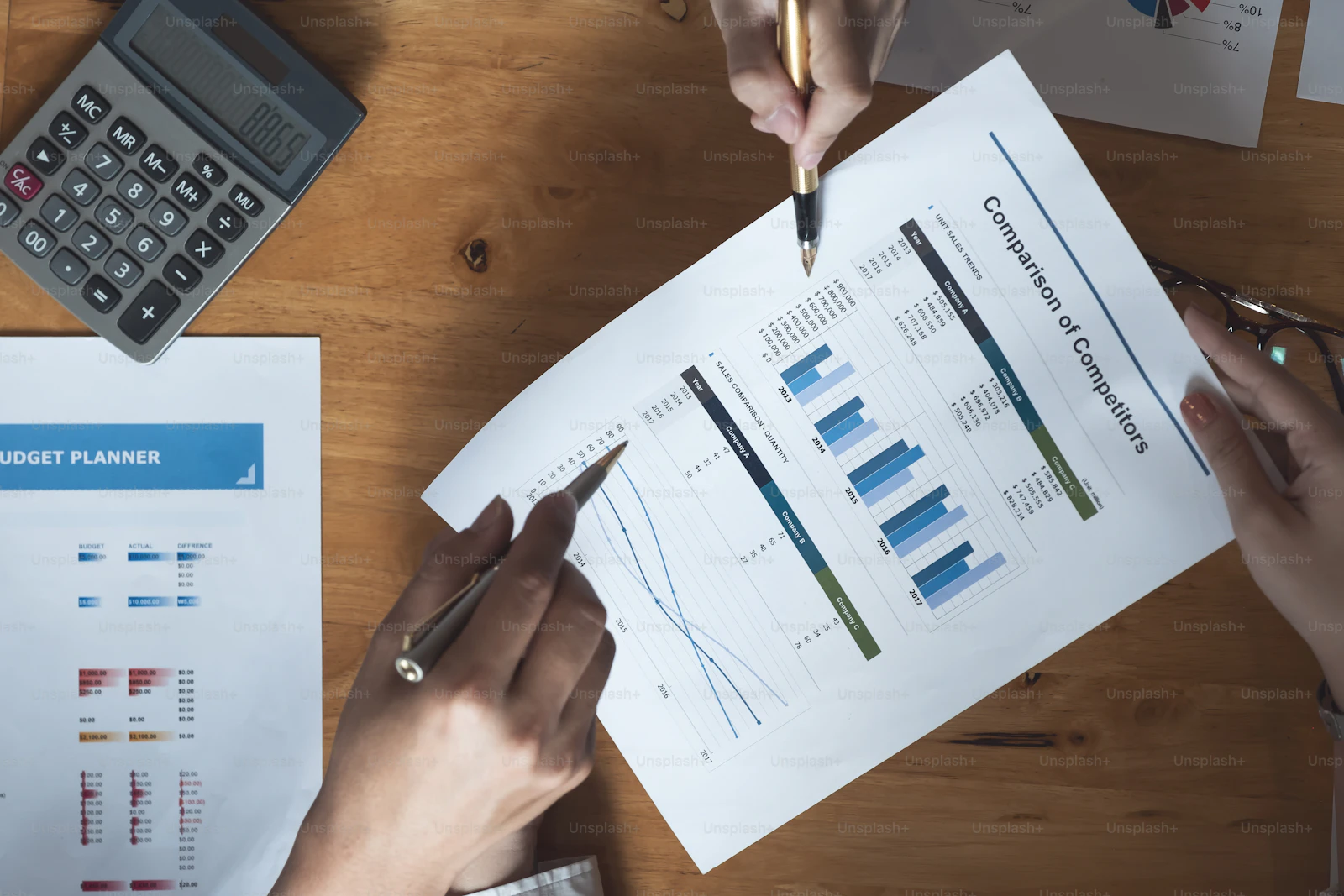 Research reports and charts arranged on a desk