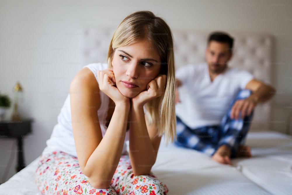 Young unhappy couple having problems in their relationship