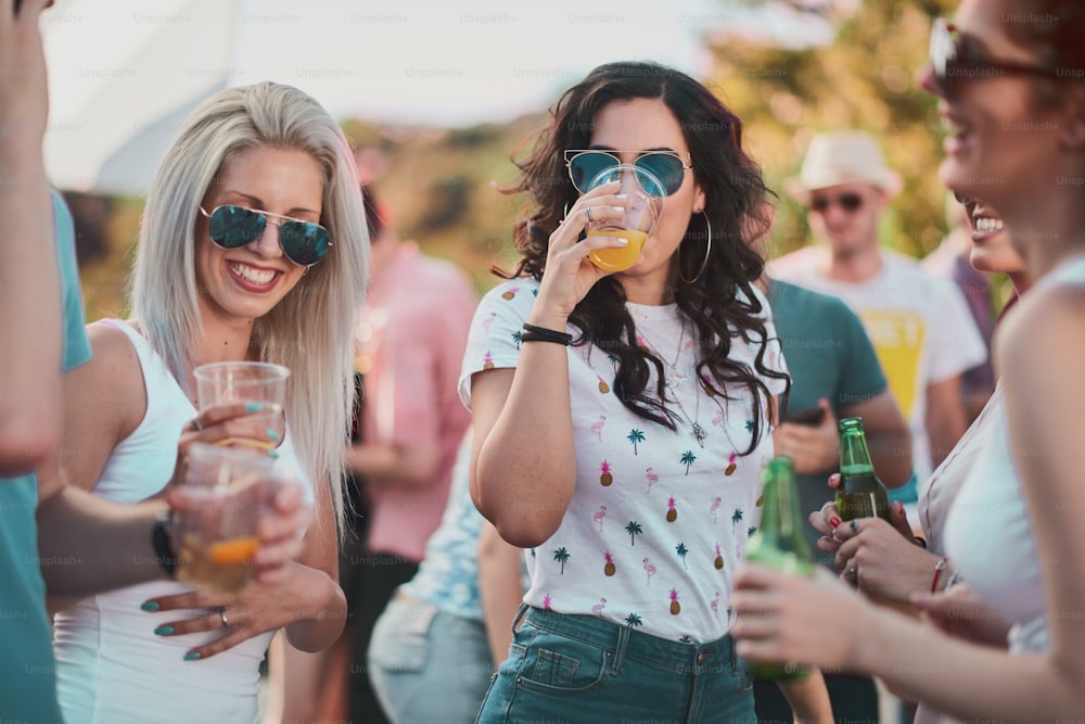 Group of people dancing and having a good time at the outdoor party/music festival