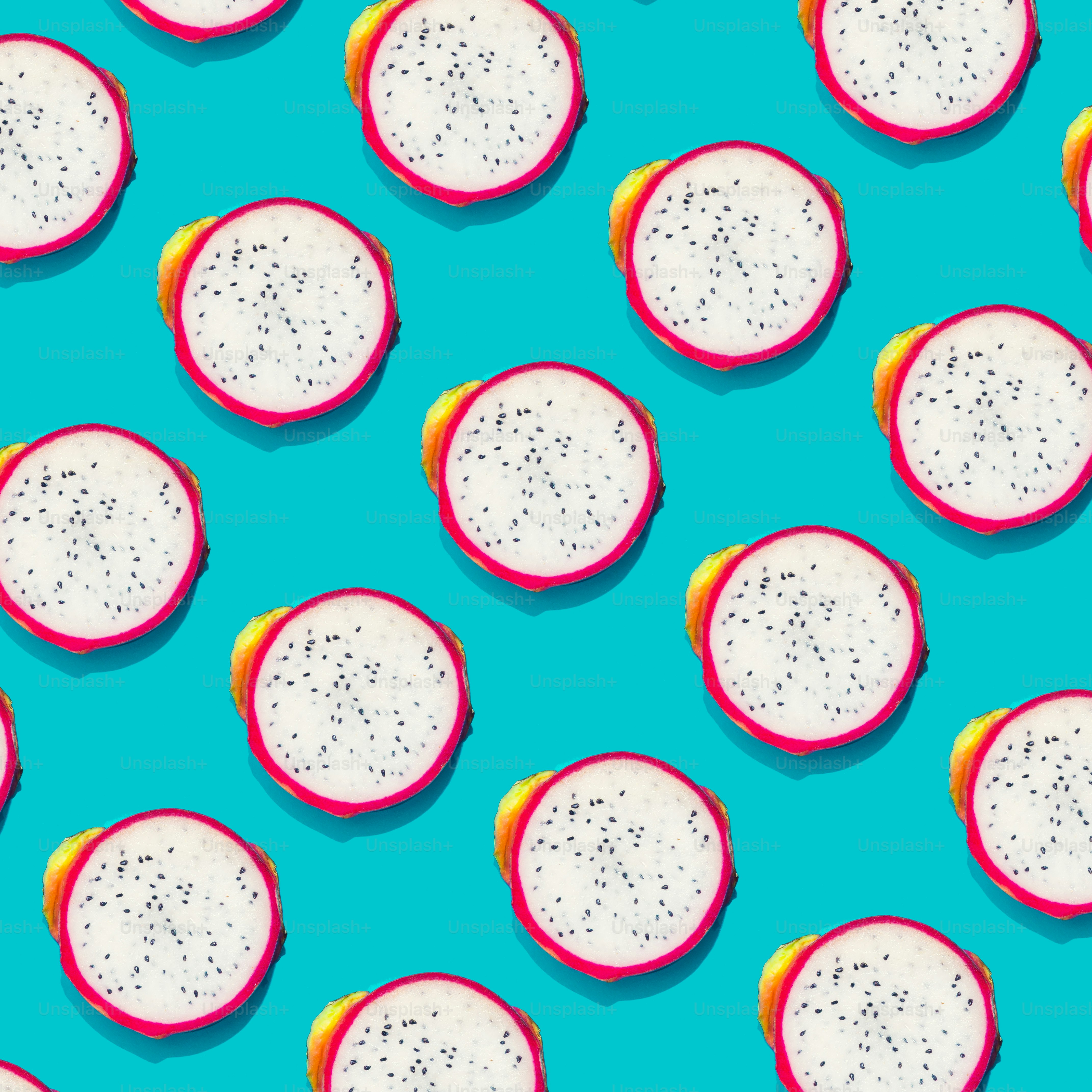 Dragonfruit creative tropical pattern vivid blue background. Abstract summer art background. Minimal print concept. Flat lay food.