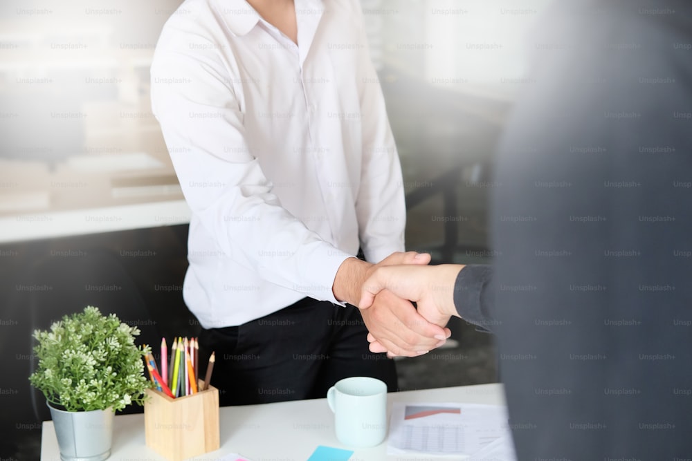 Business Partnership concept. businessman shaking hands finishing up a meeting,acquisition concept.