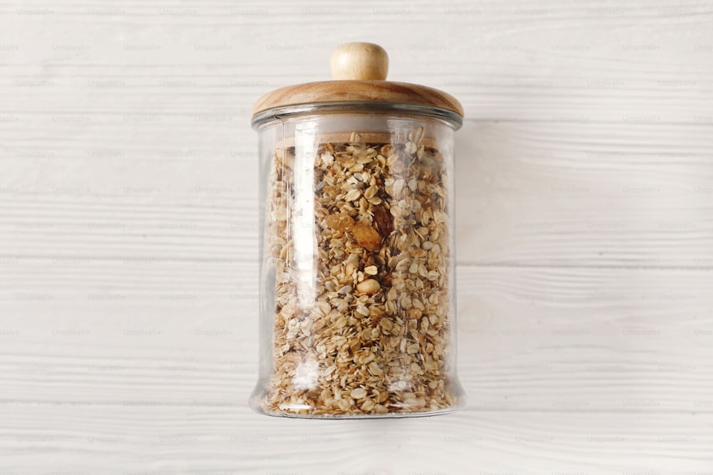 granola in glass, flat lay. bulk store concept. delicious muesli eco friendly breakfast. plastic free items. sustainable lifestyle concept. zero waste.reuse, reduce, recycle, refuse