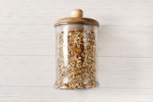 granola in glass, flat lay. bulk store concept. delicious muesli eco friendly breakfast. plastic free items. sustainable lifestyle concept. zero waste.reuse, reduce, recycle, refuse