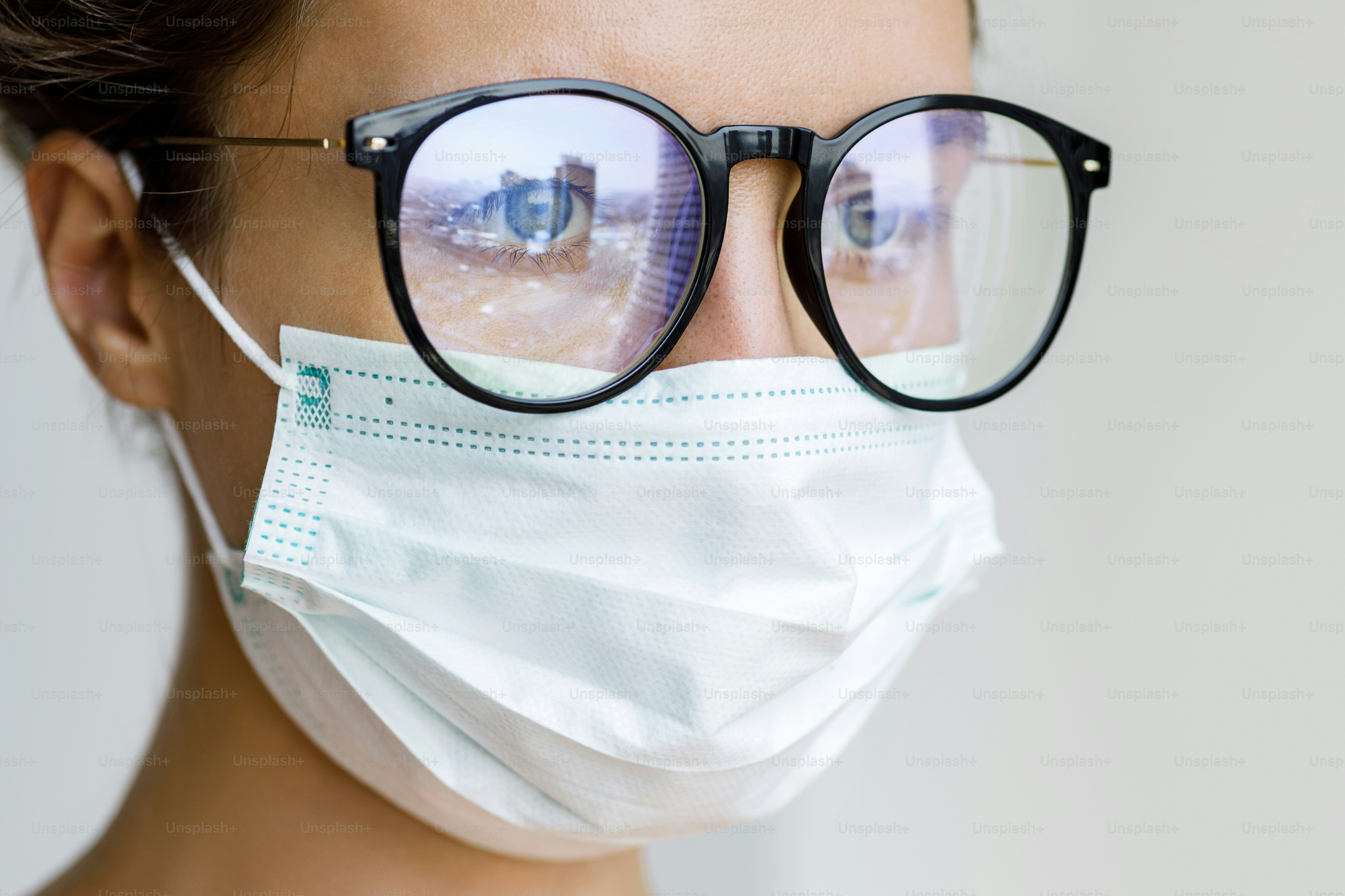 Healthcare - Woman wearing face mask because of air quality or virus epidemic