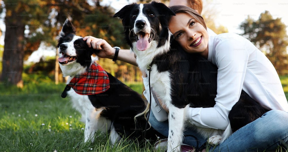Beautiful woman and dog enjoying their time outdoors in nature