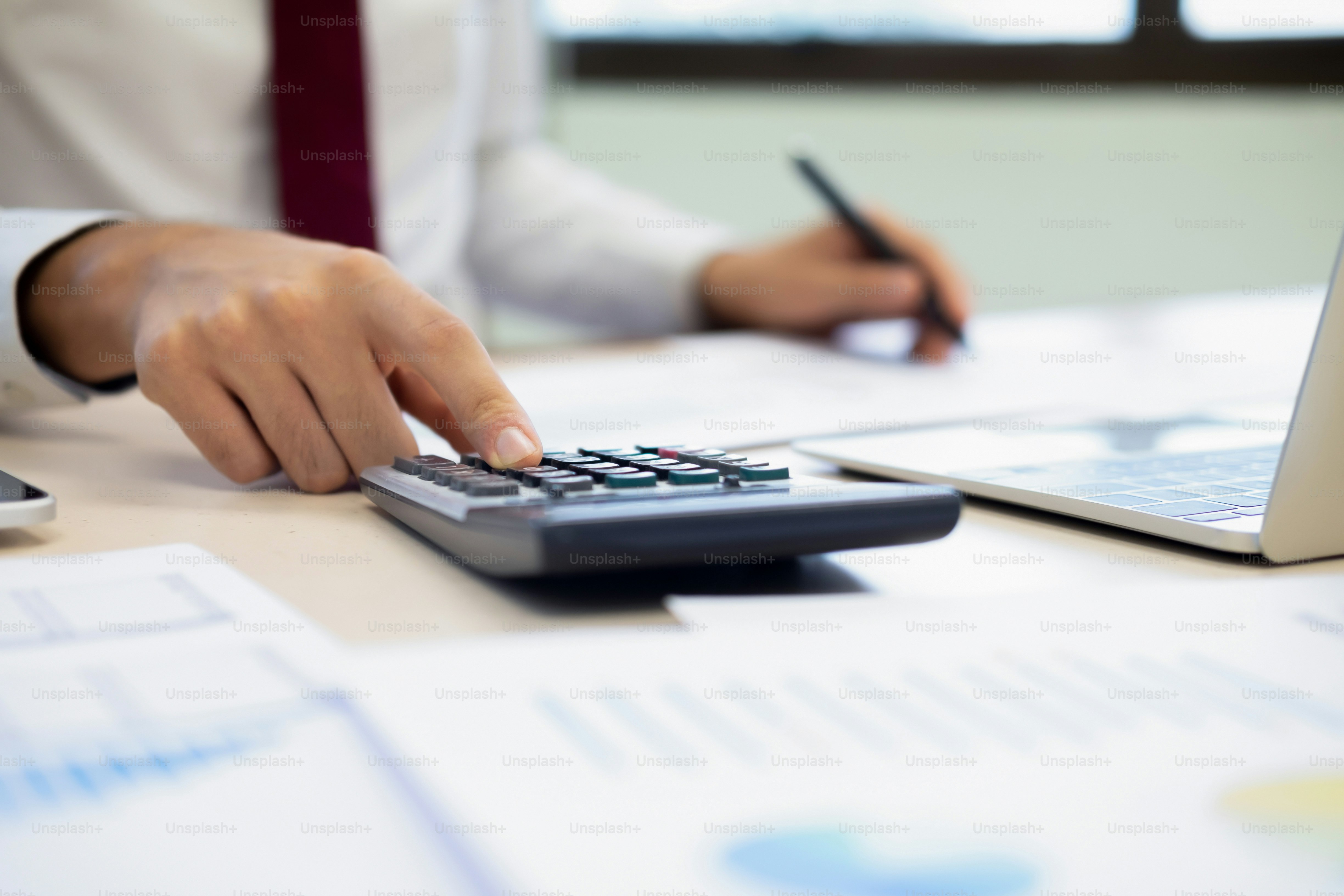 Finances Saving Economy concept. Male accountant or banker calculate the cash bill.