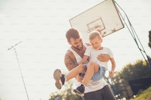 Funny time for us. Father and son on basket court.
