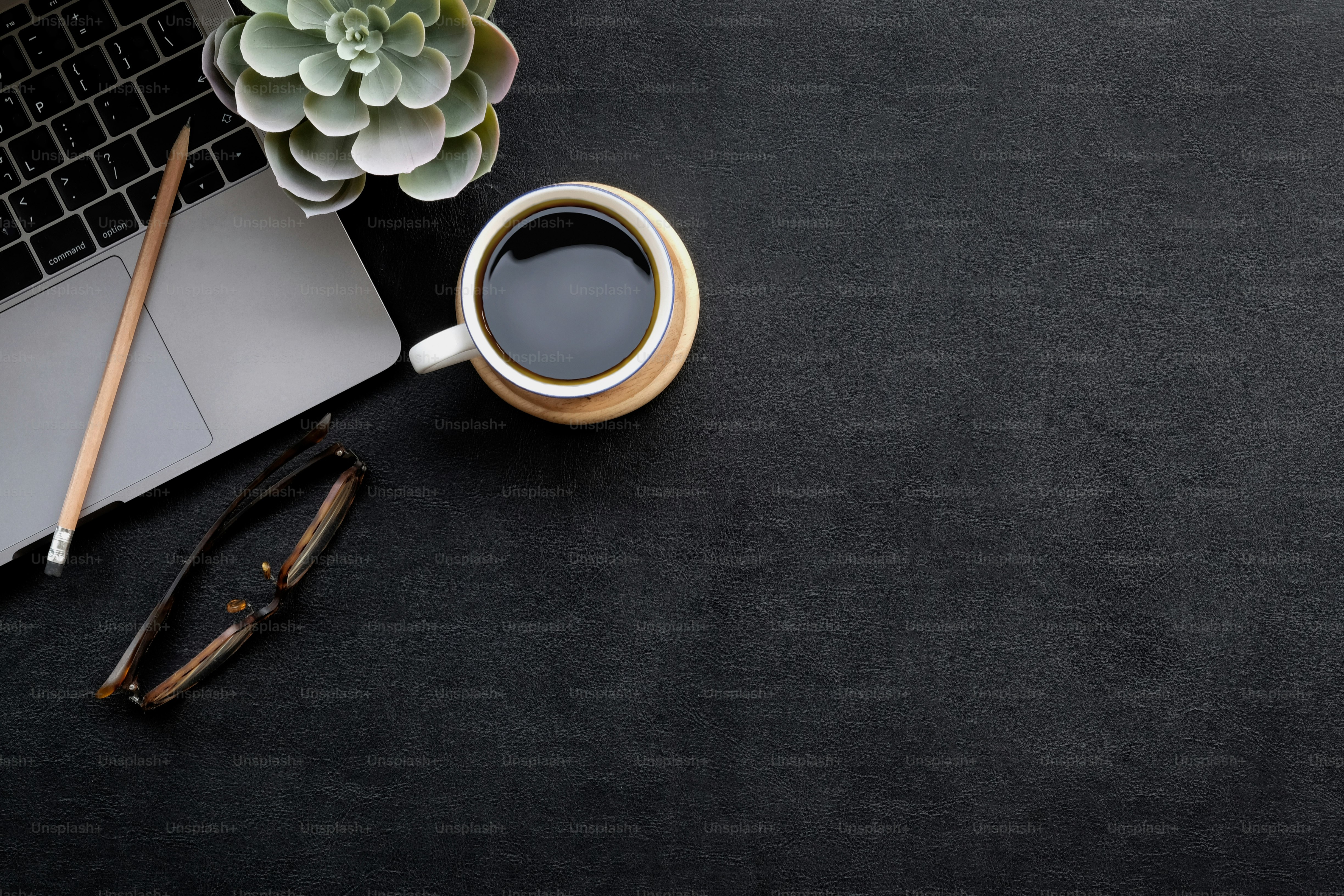 Dark office leather workspace desk and supplies. Workplace and copy space