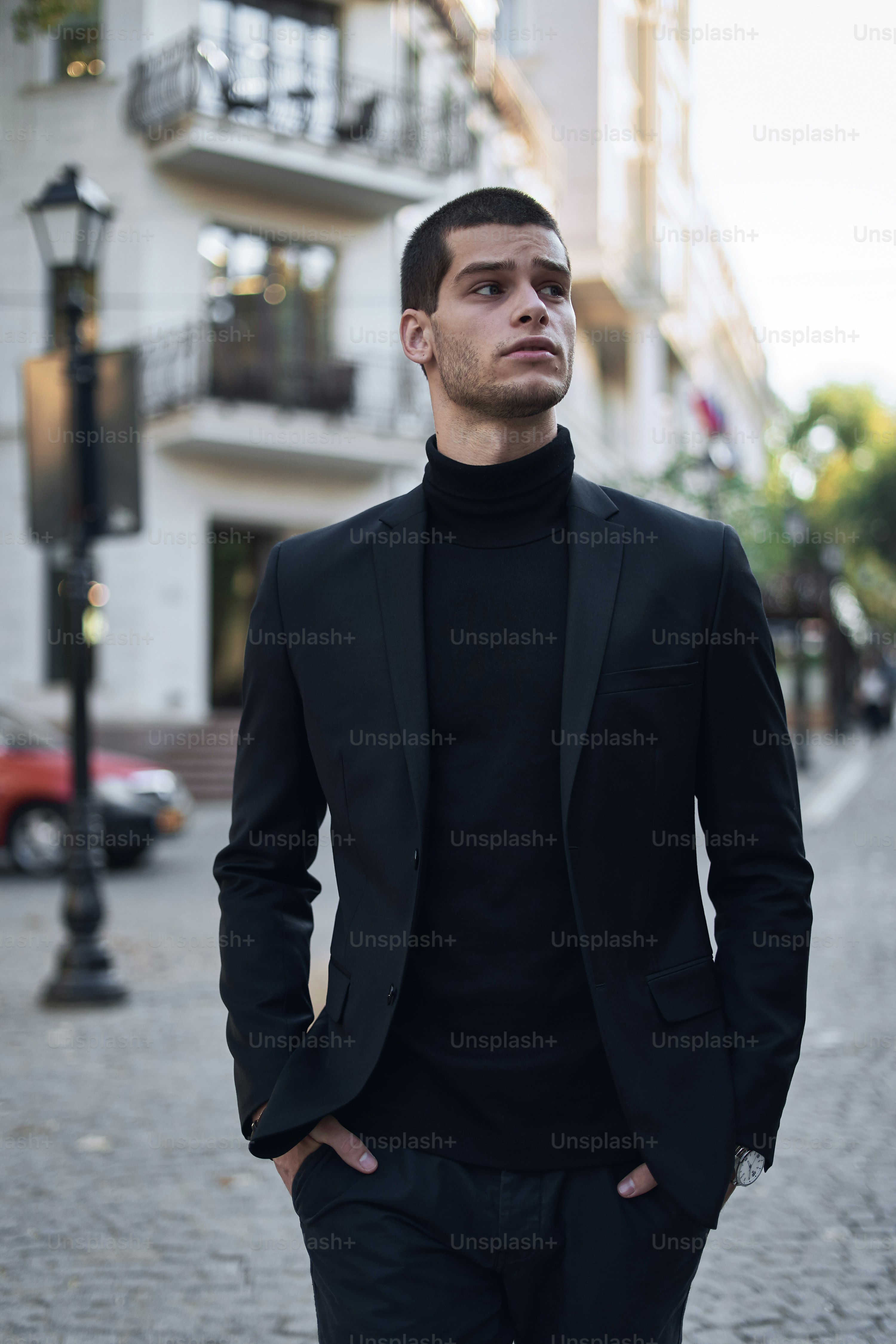 Young man walking, smart casual on an autumn day on a street of European City. Lifestyle Photography
