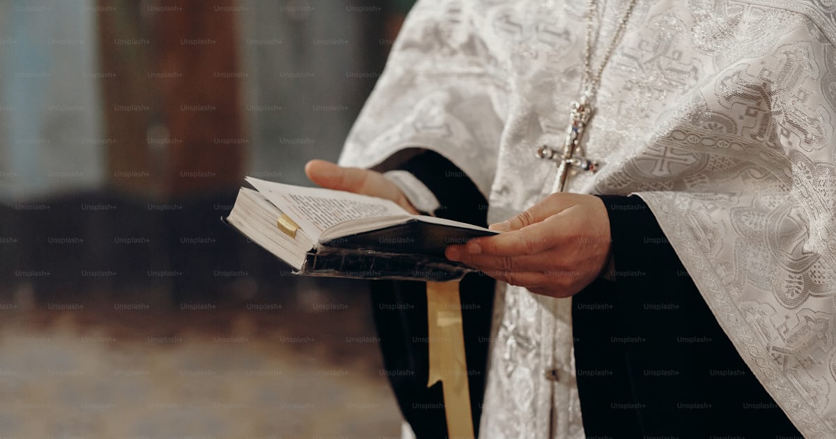 Priest reading holy bible in christian church during orthodox wedding ...