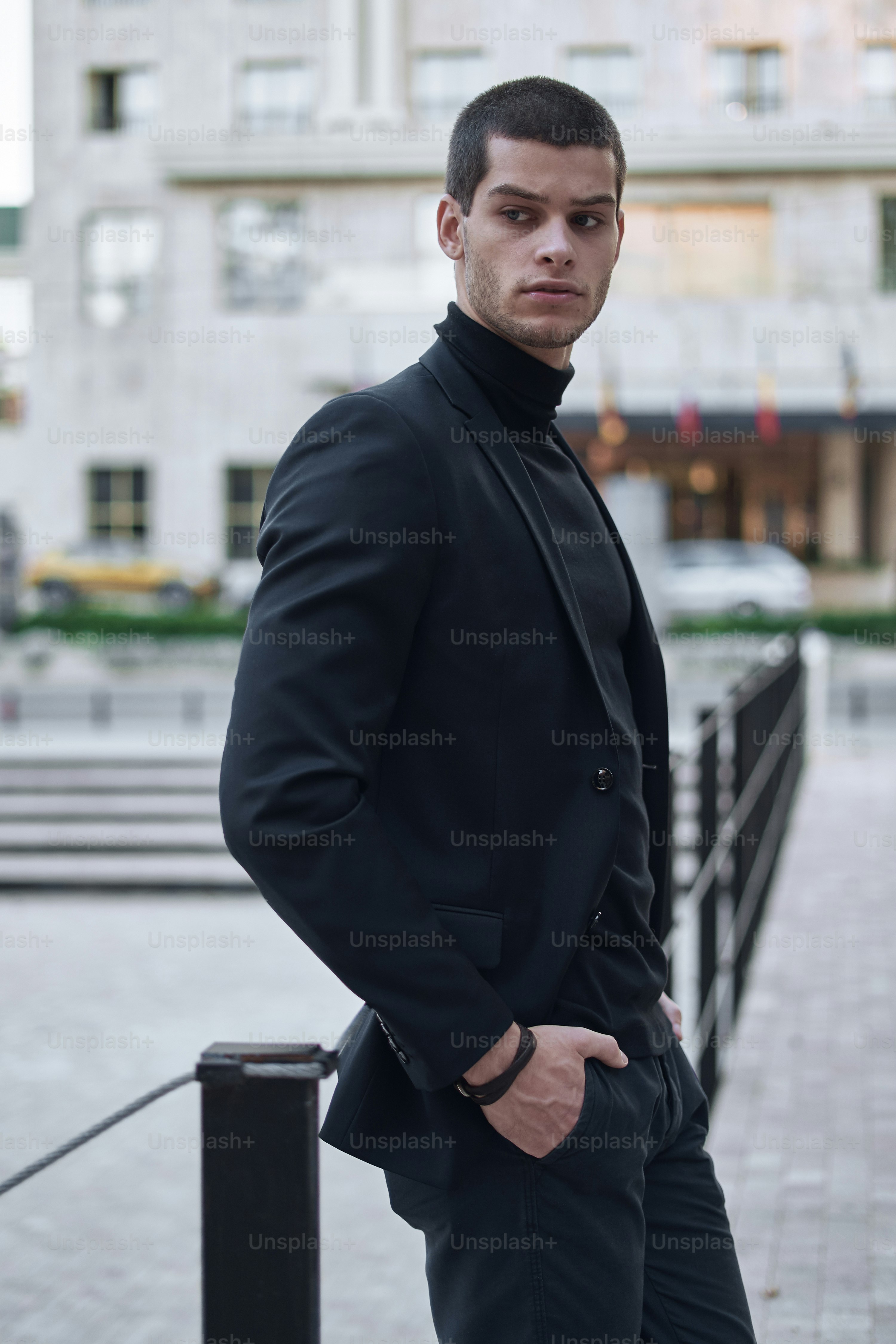 Young man walking, smart casual on an autumn day on a street of European City. Lifestyle Photography