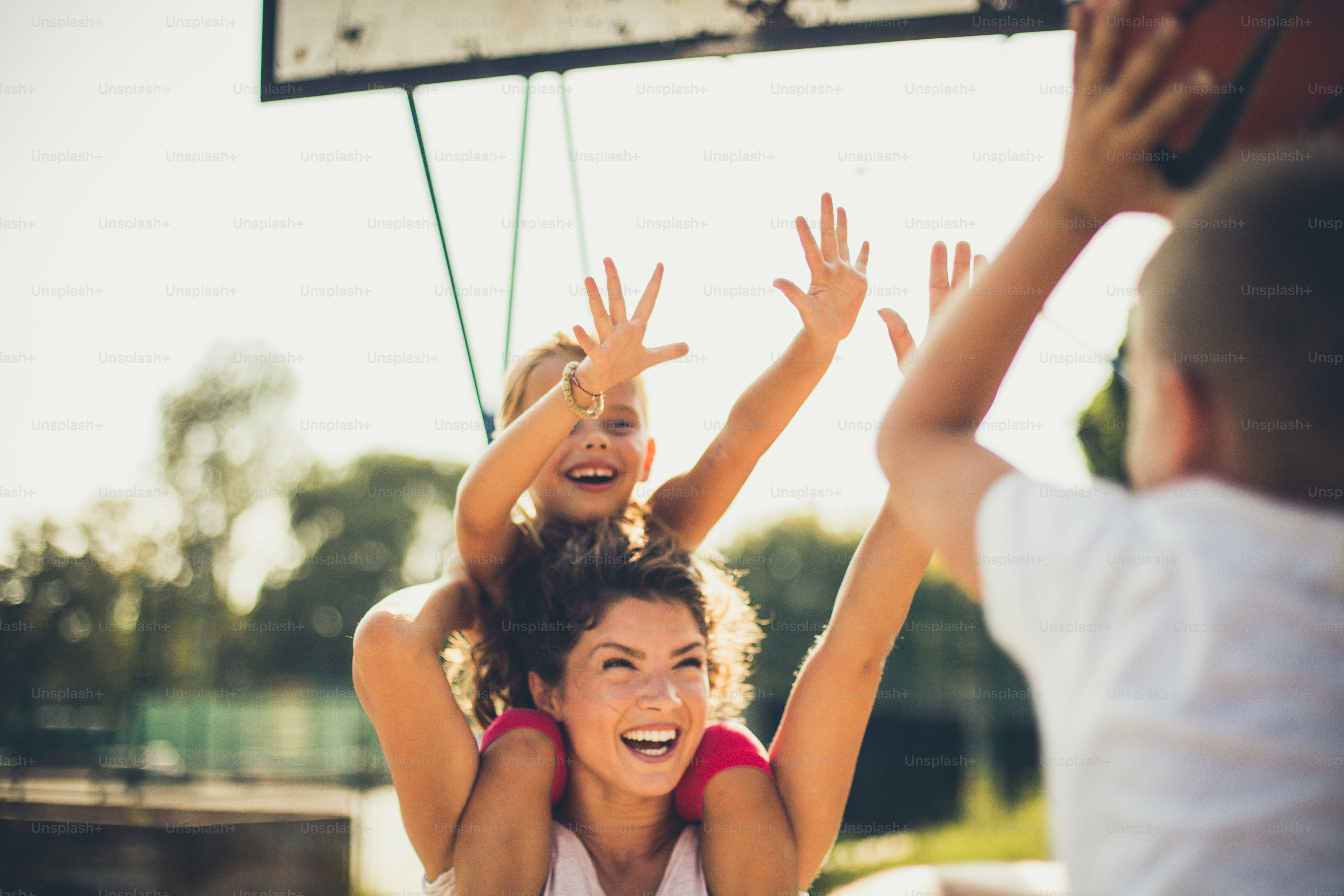 I will not let you. Family playing basketball. Close up.