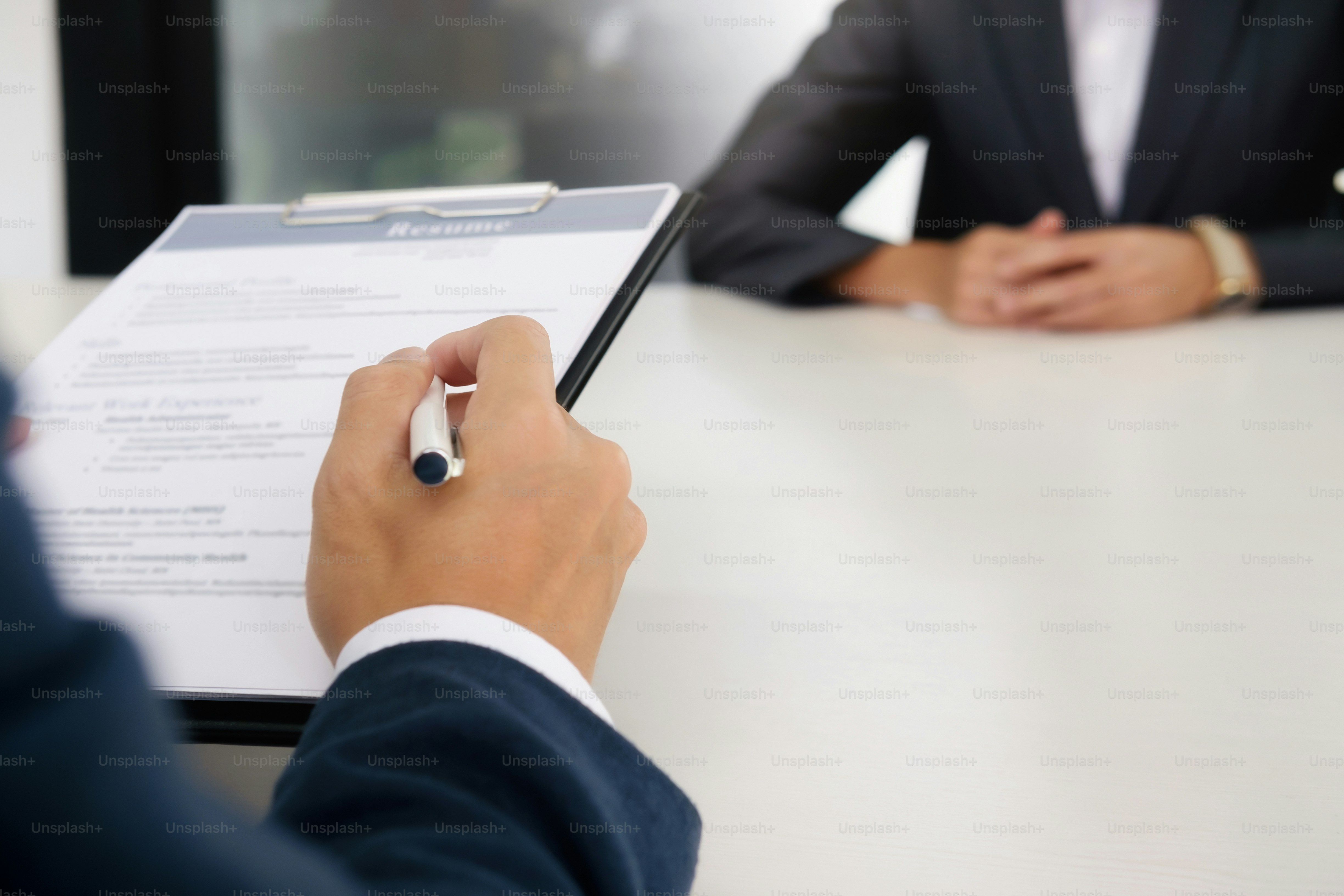 Business situation, job interview concept. Confident businessman in a job interview with a corporate personnel manager.