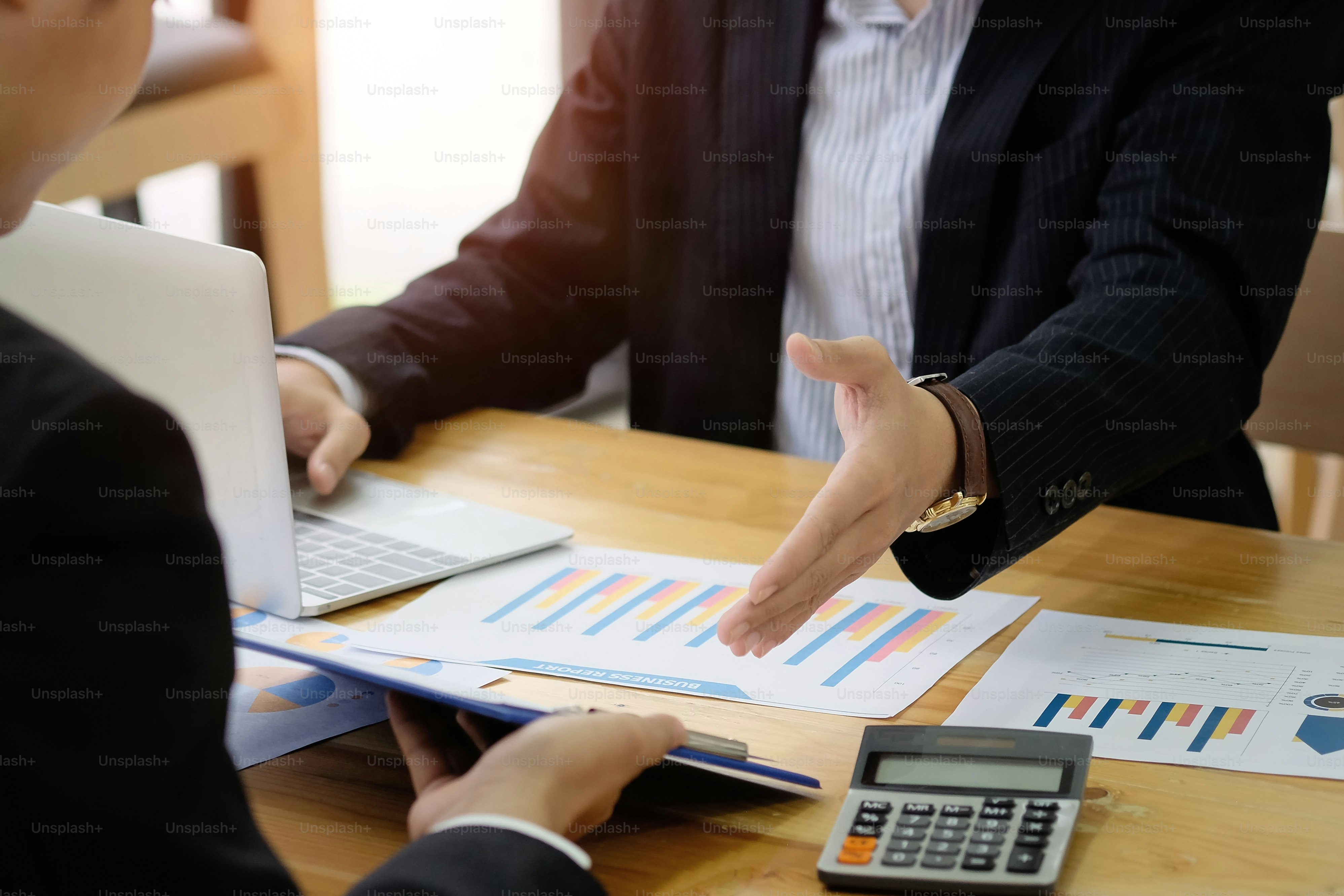 Business colleagues analysis a valuation investment and finance control with document paper.