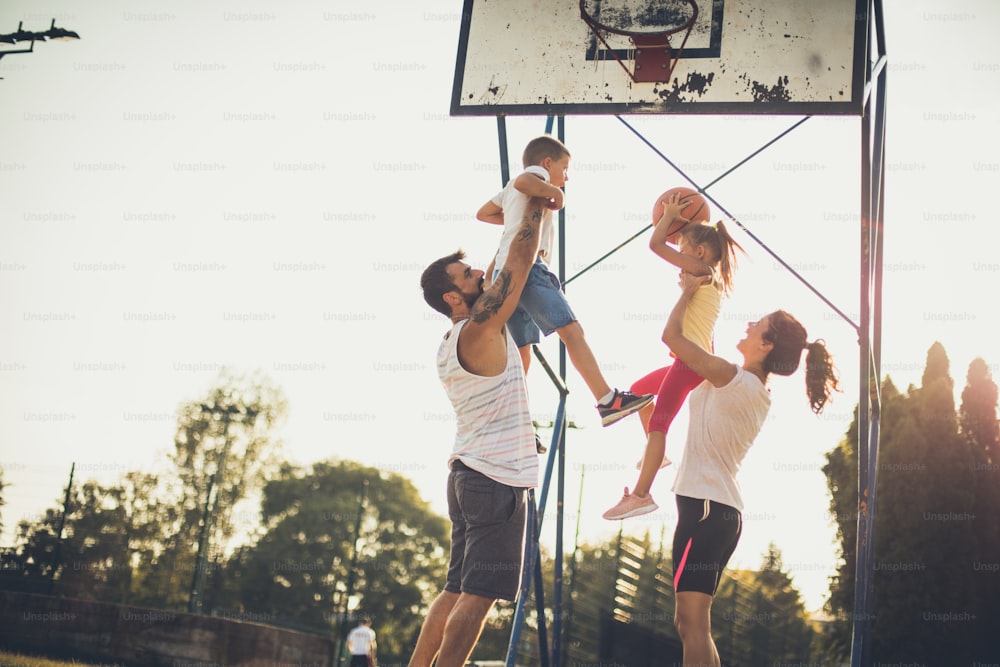 Day for fun. Family on basketball court.