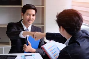 Partnership business concept, Two people bump hands after business meeting.