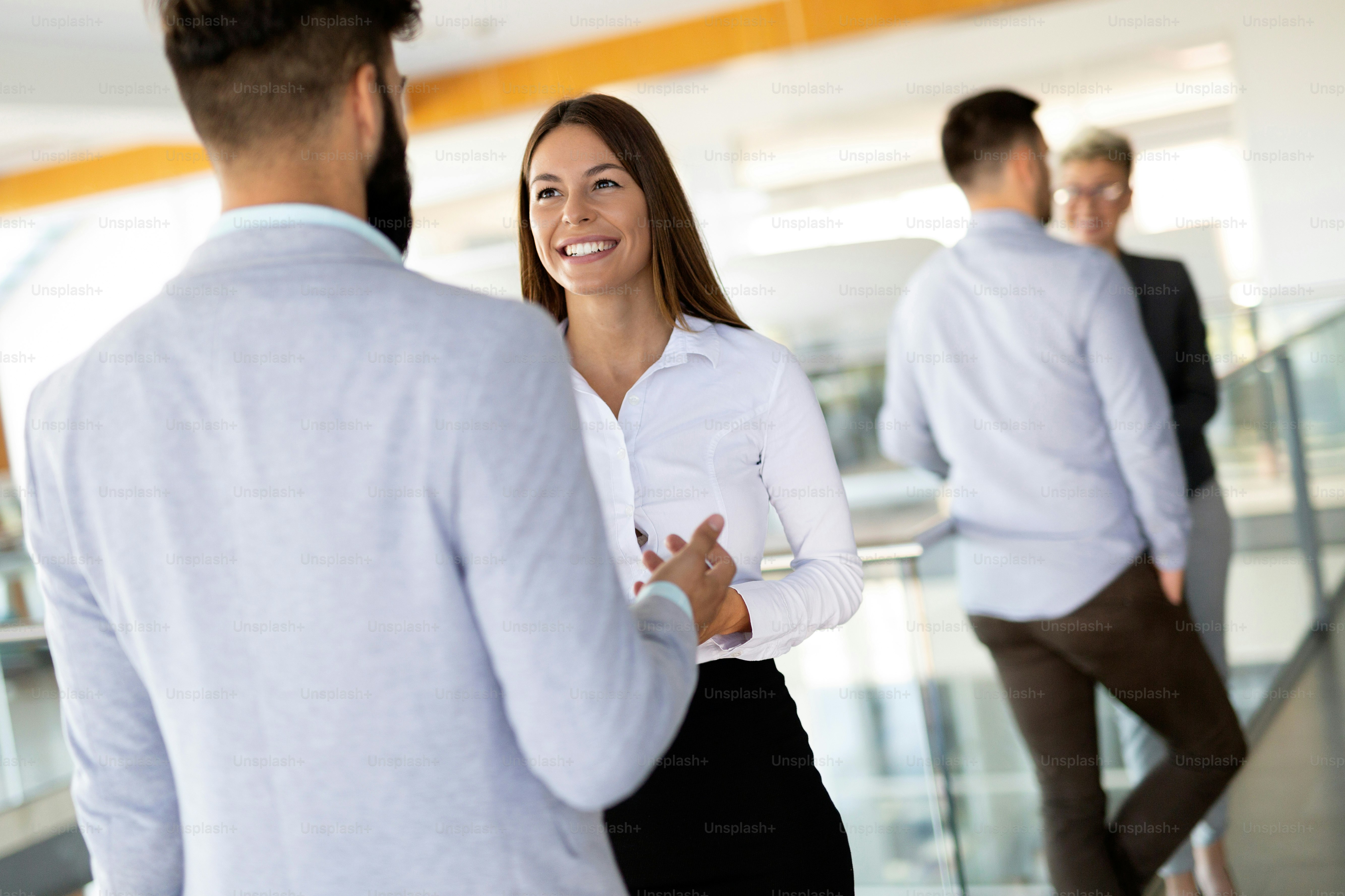 Business people having fun and chatting at workplace office