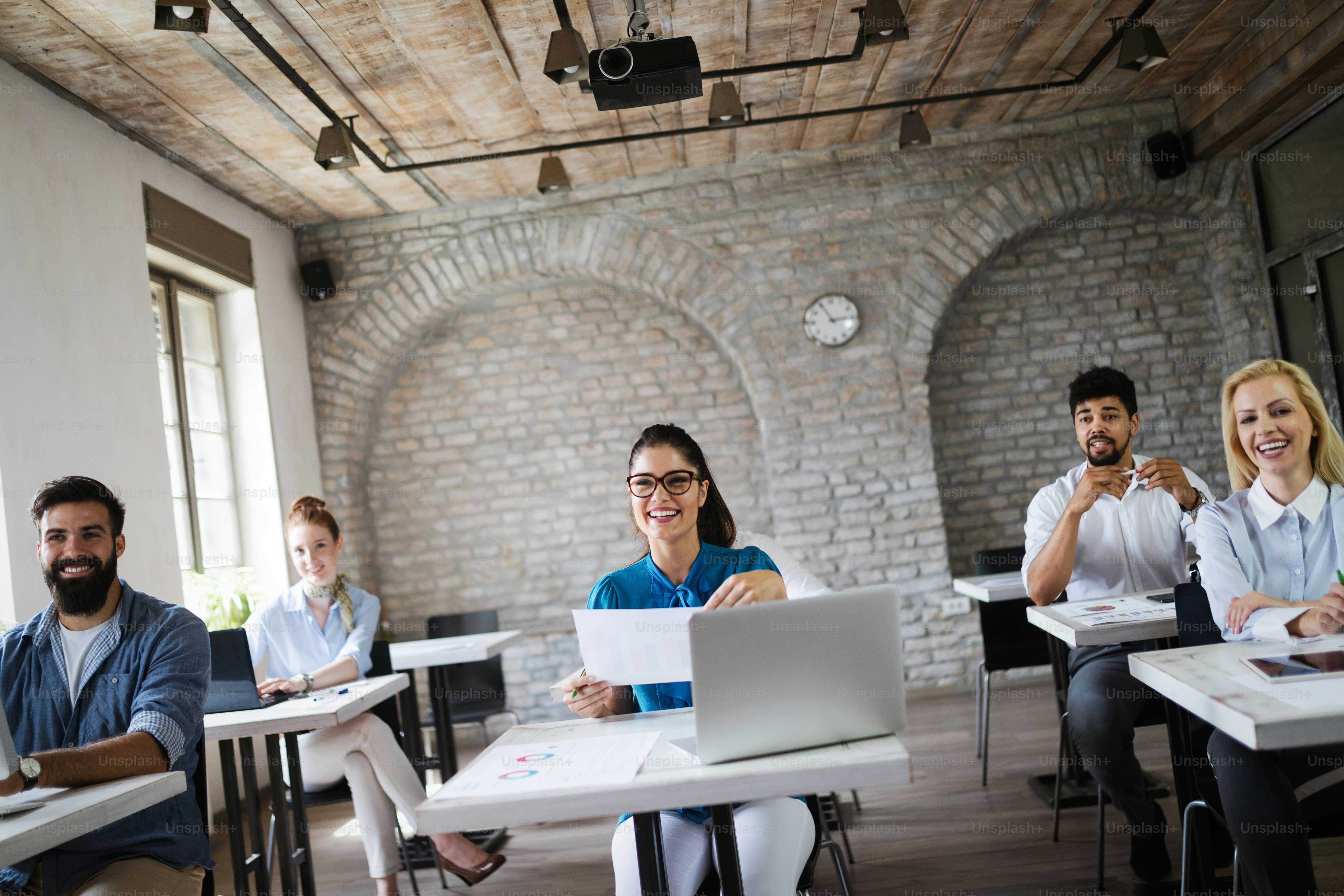 Successful happy group of students learning software engineering and business during presentation