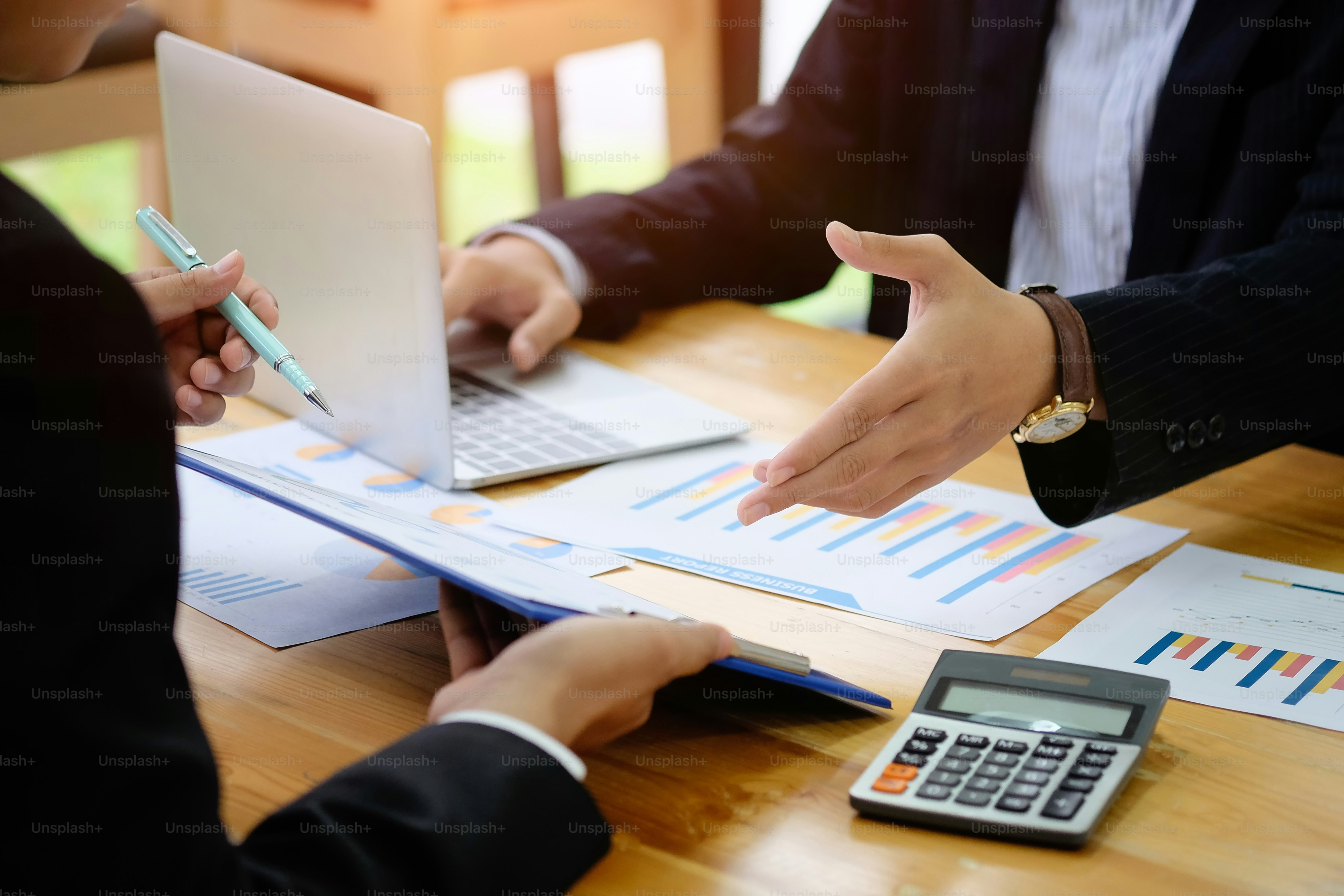 Business colleagues analysis a valuation investment and finance control with document paper