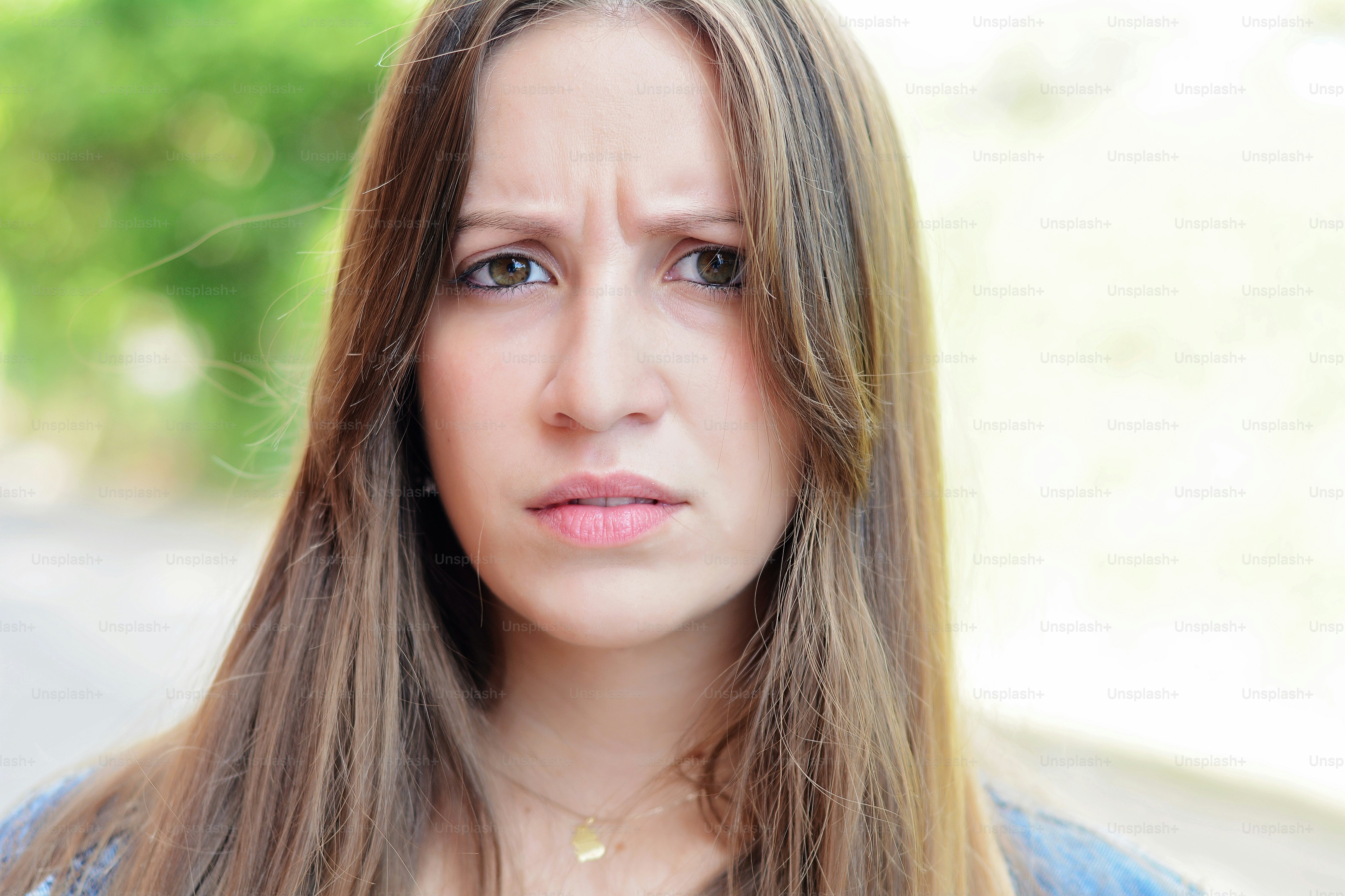 Portrait of angry young latin woman. Outdoors