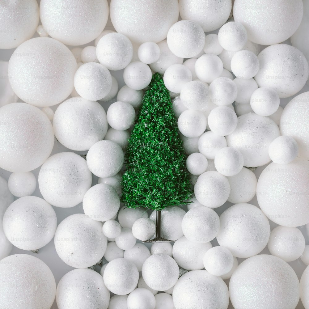 Christmas tree in white snow balls decoration.