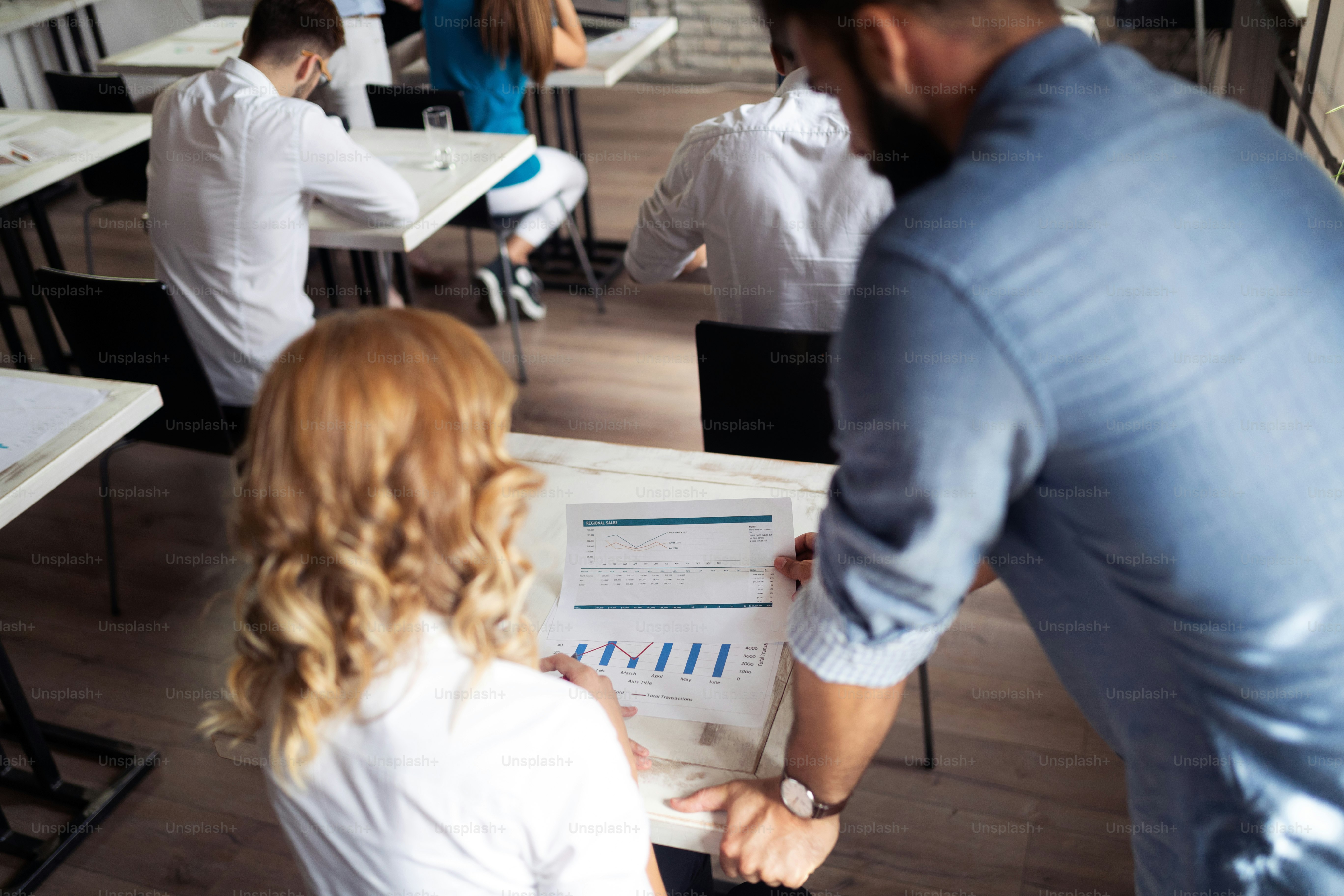 Successful happy group of students learning software engineering and business during presentation