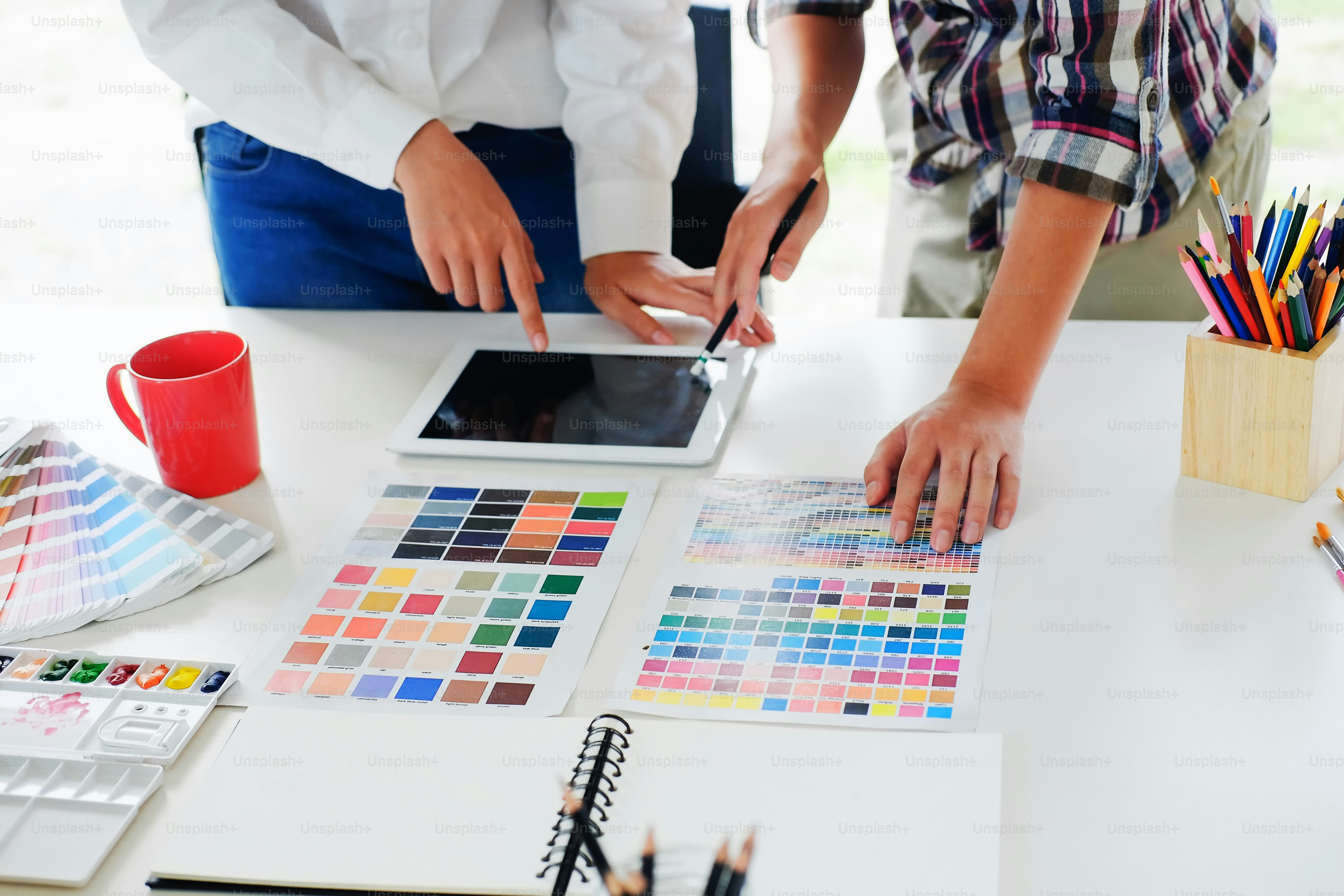 Cropped shot of artist creative meeting with tablet digital to planing project.