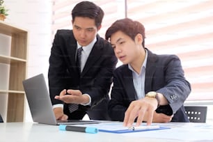 Business project team working together at meeting room at office Mature businessman discuss information with a younger colleague.