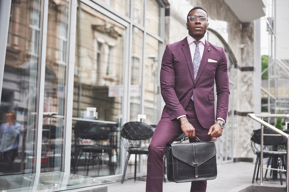 Portrait of a young beautiful African American businessman with a briefcase. Business meeting