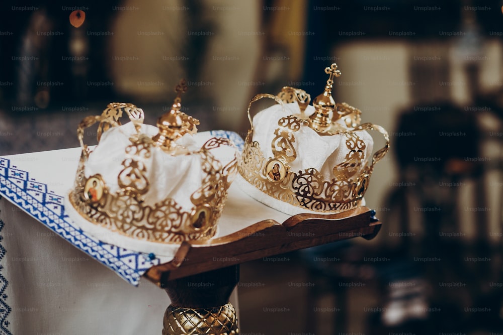 golden christianity crowns on altar in church for wedding ceremony. space for text. religion unity concept . traditional ritual