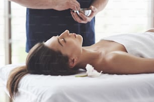 The masseur prepares for the procedure, massage with a health-improving effect. Relaxation pleasure