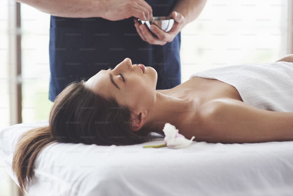 The masseur prepares for the procedure, massage with a health-improving effect. Relaxation pleasure