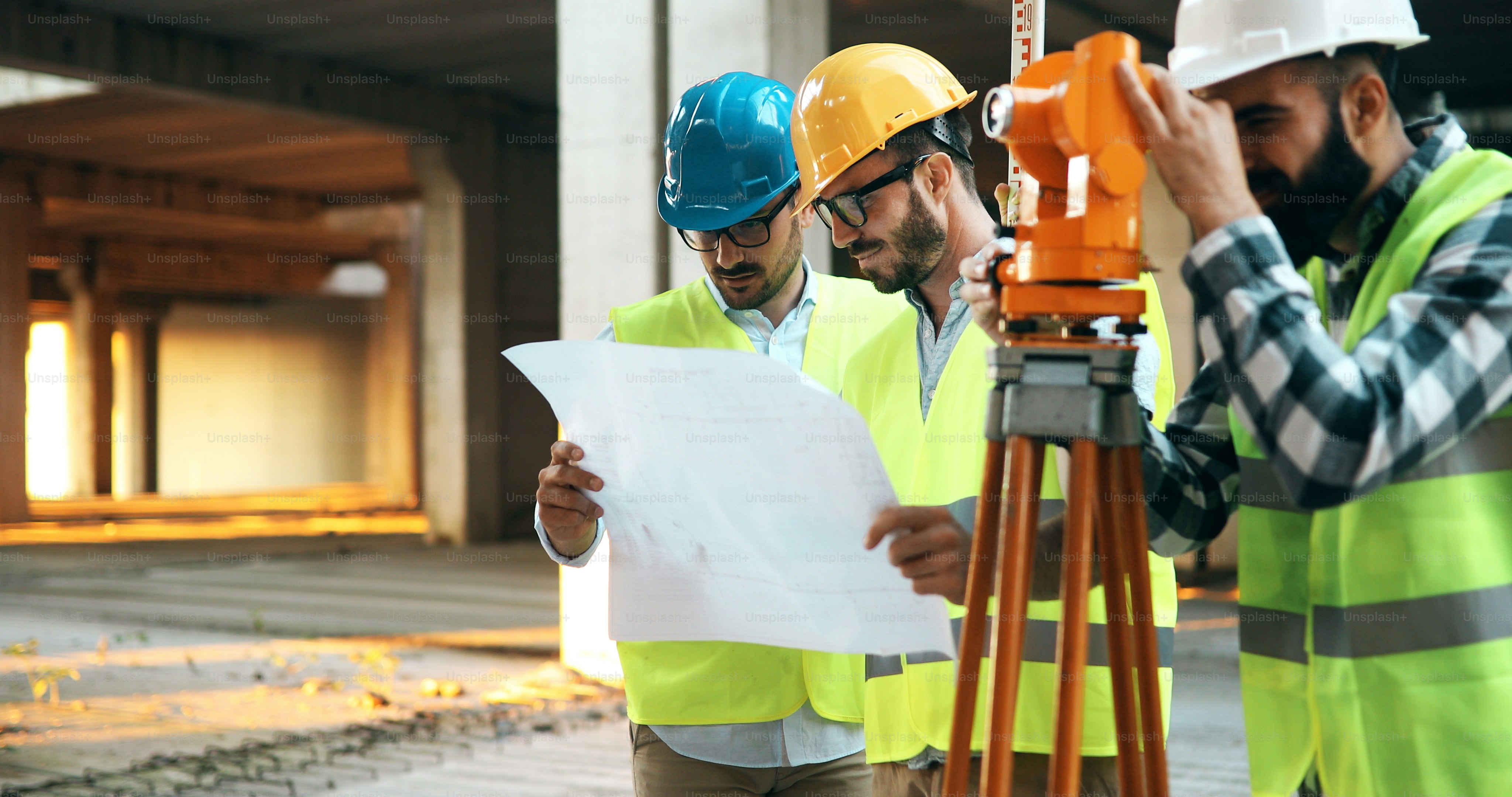 Portrait of construction engineers working on building site together