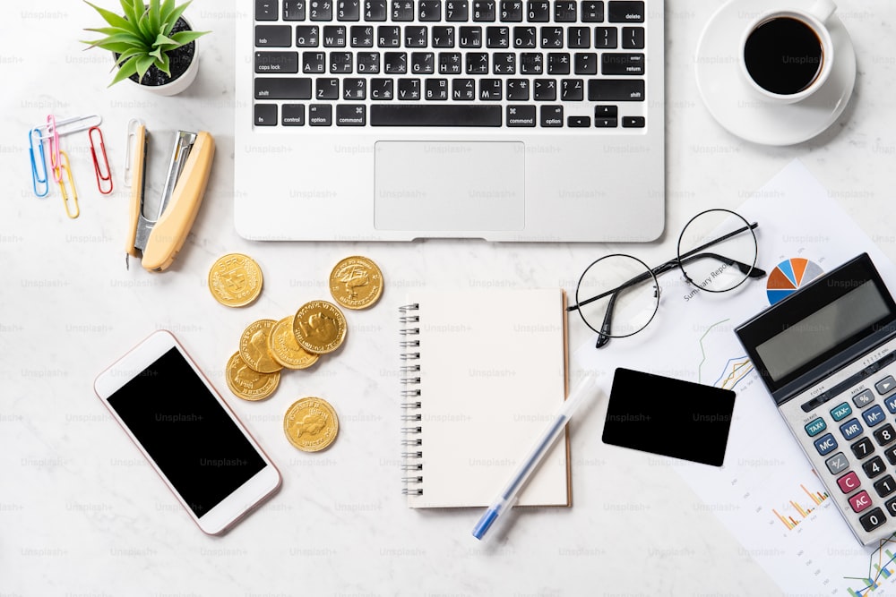 Business, accounting and payment concept with financial report data on a modern marble office table, mock up, top view, copy space, flat lay, lifestyle