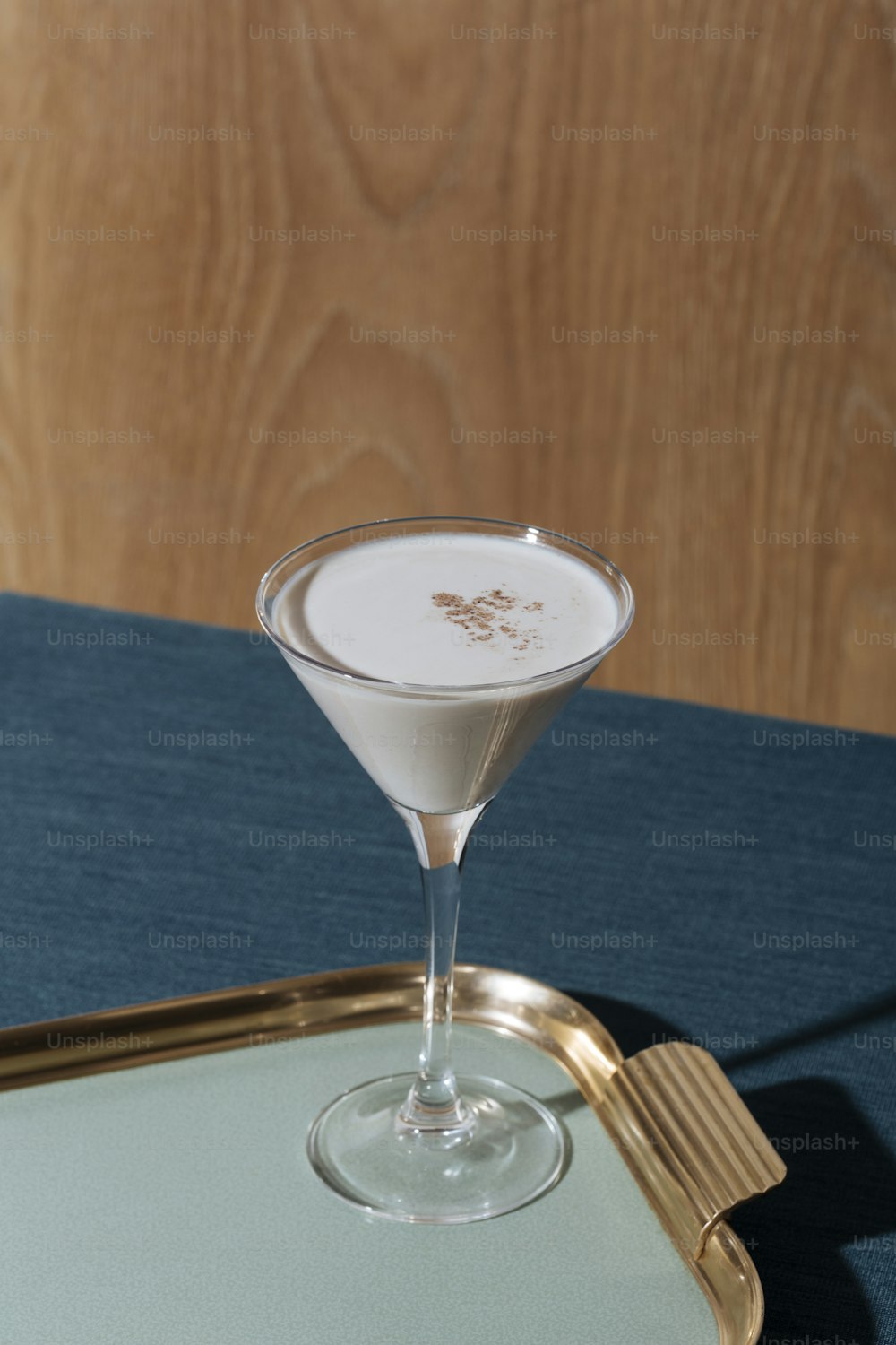 An after dinner cocktail with gin or cognac, white creme de cacao, fresh cream and  grated nutmeg.