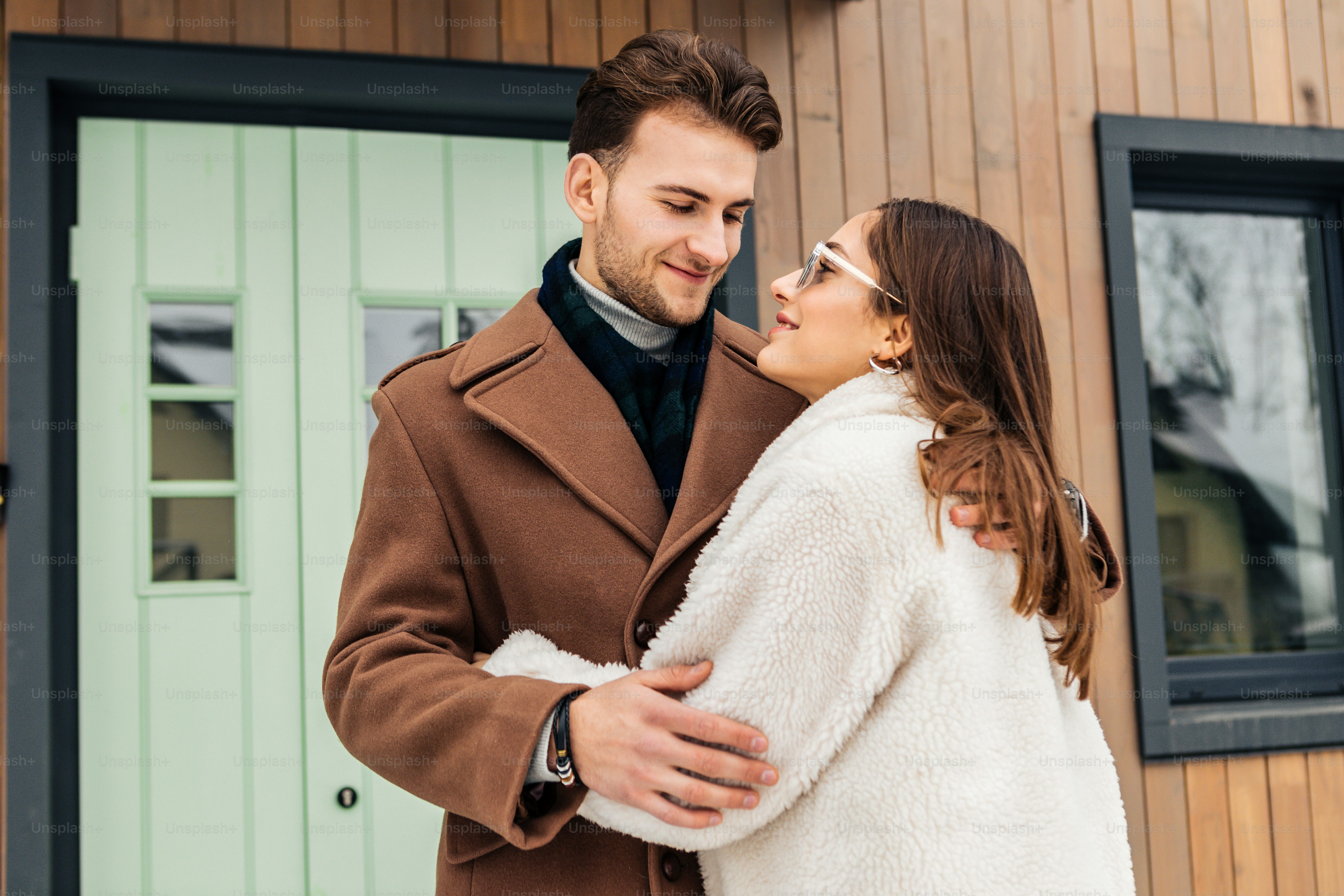 Winter walk. Handsome bearded man enjoying winter walk with his appealing lovely girlfriend