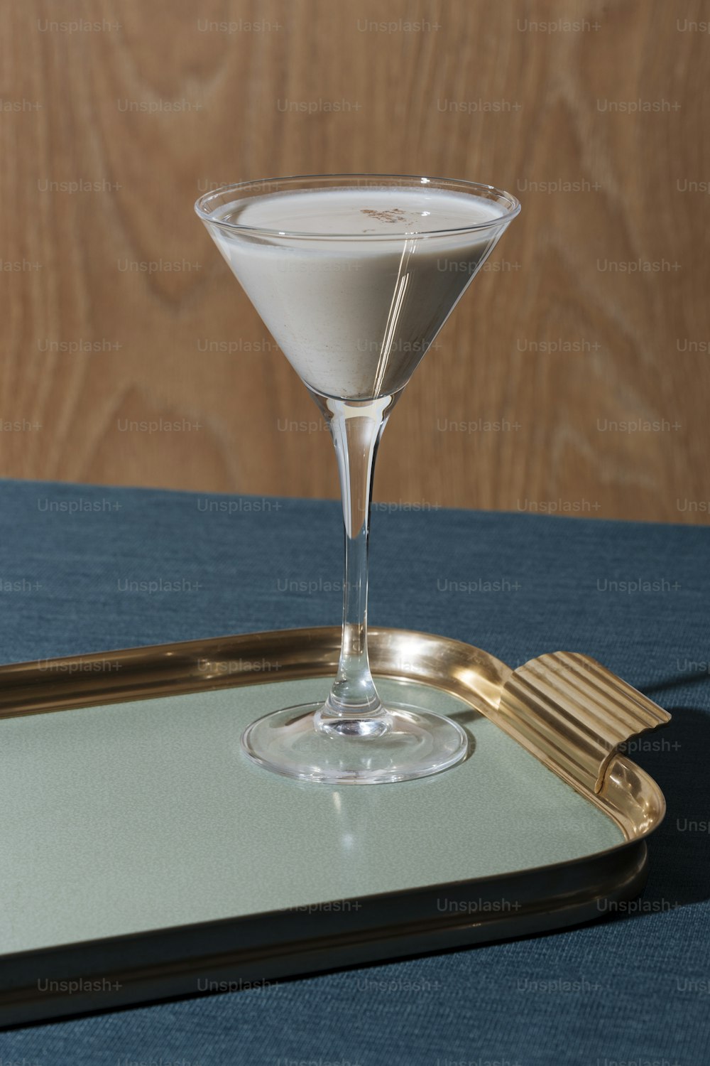 Shake all ingredients with ice and strain contents into a cocktail glass. Sprinkle nutmeg on top and serve.