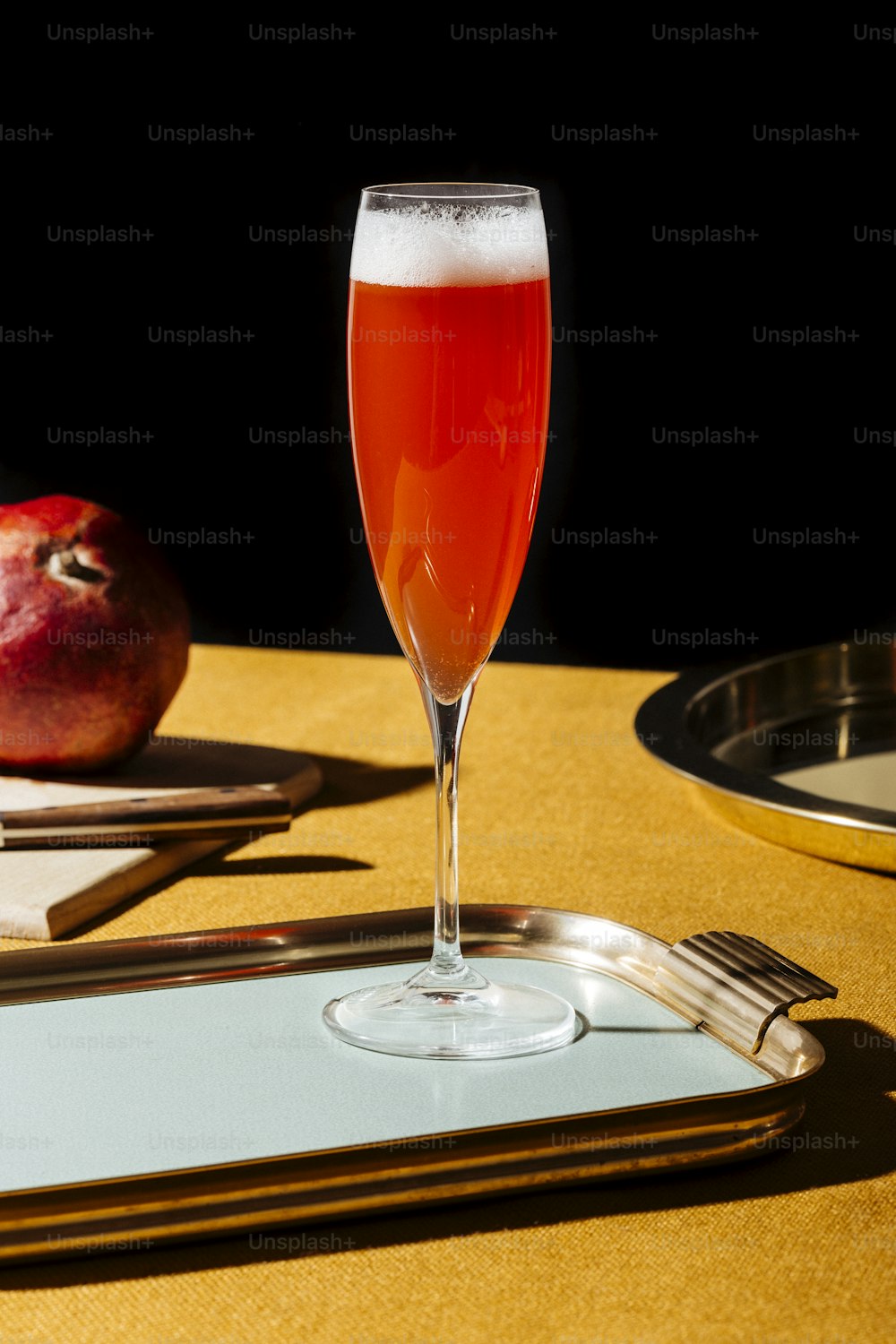 Tintoretto, an italian cocktail with 2/3 Prosecco (or Champagne) and 1/3 pomegranate juice, served in a flute. Pop contemporary style