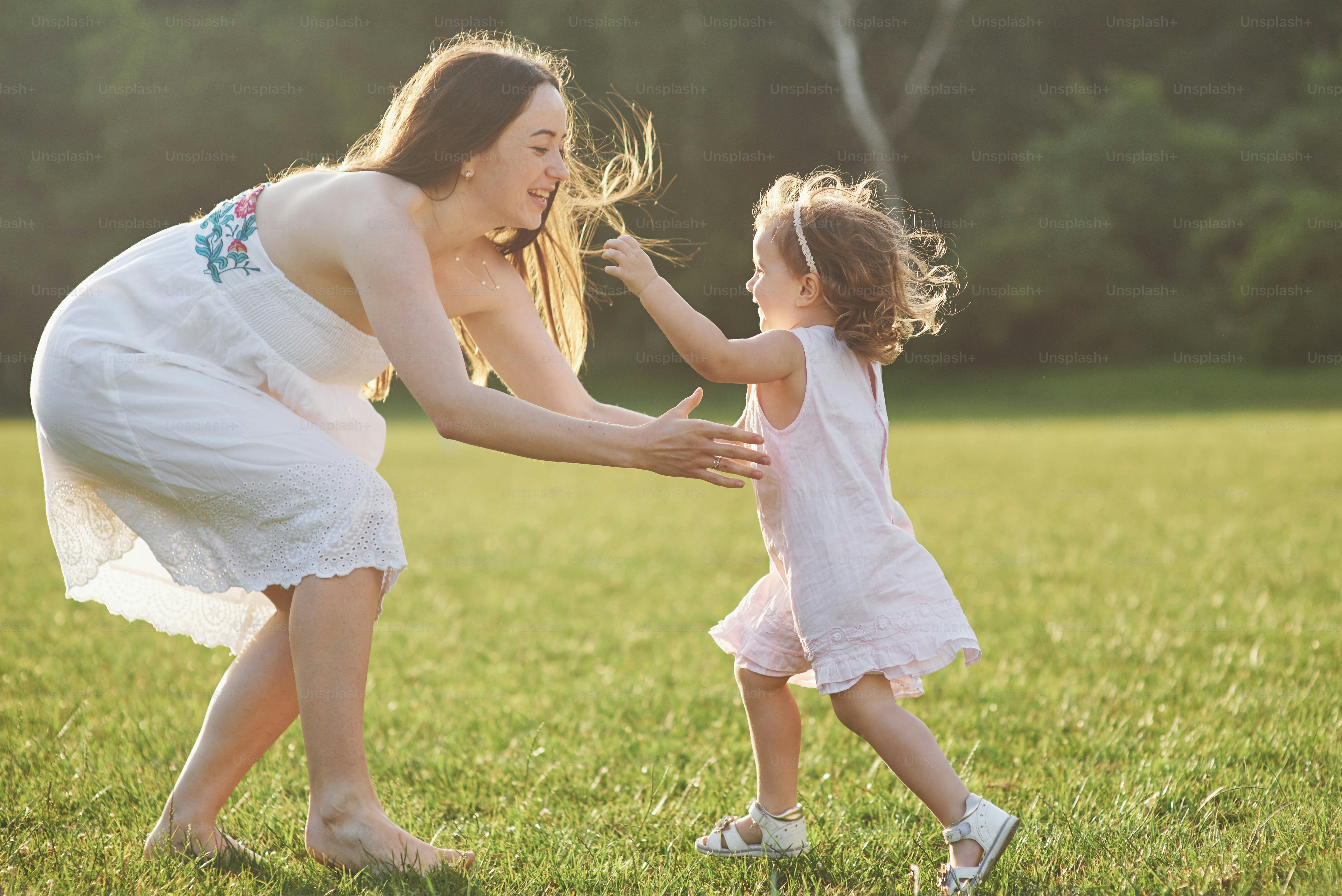 Happy family, active mother with little child, adorable toddler girl.
