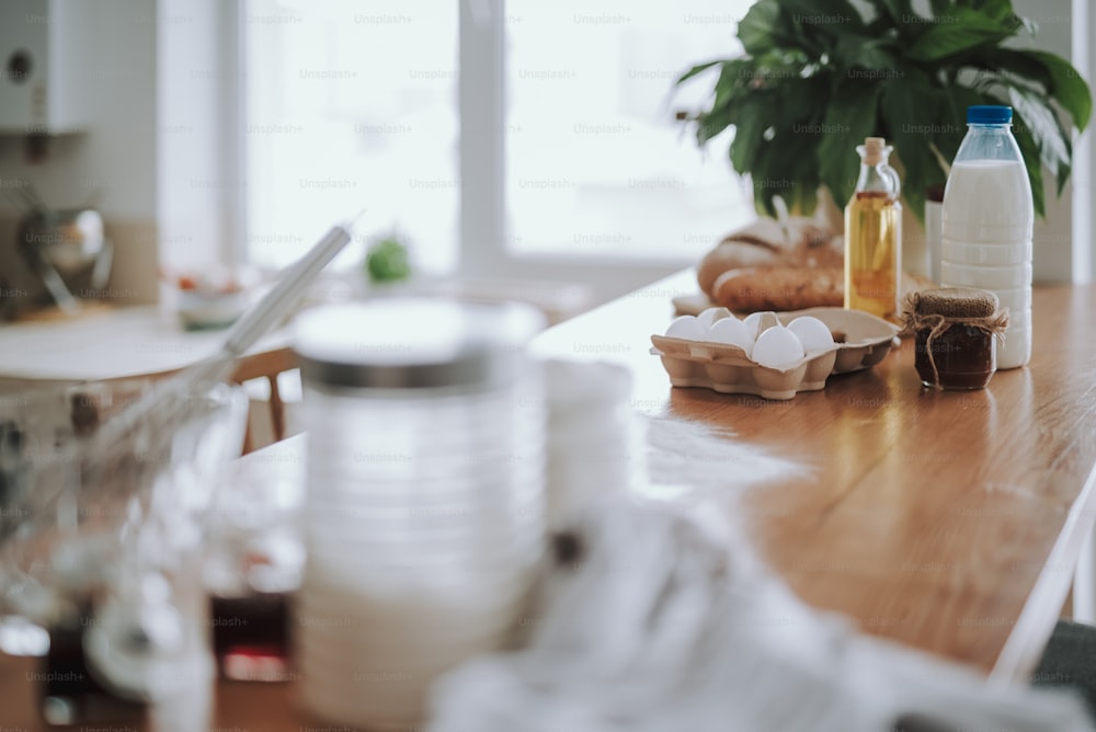 Focus on oil and eggs with other products for making dough. They are waiting for being used for cooking tasty homemade pastry