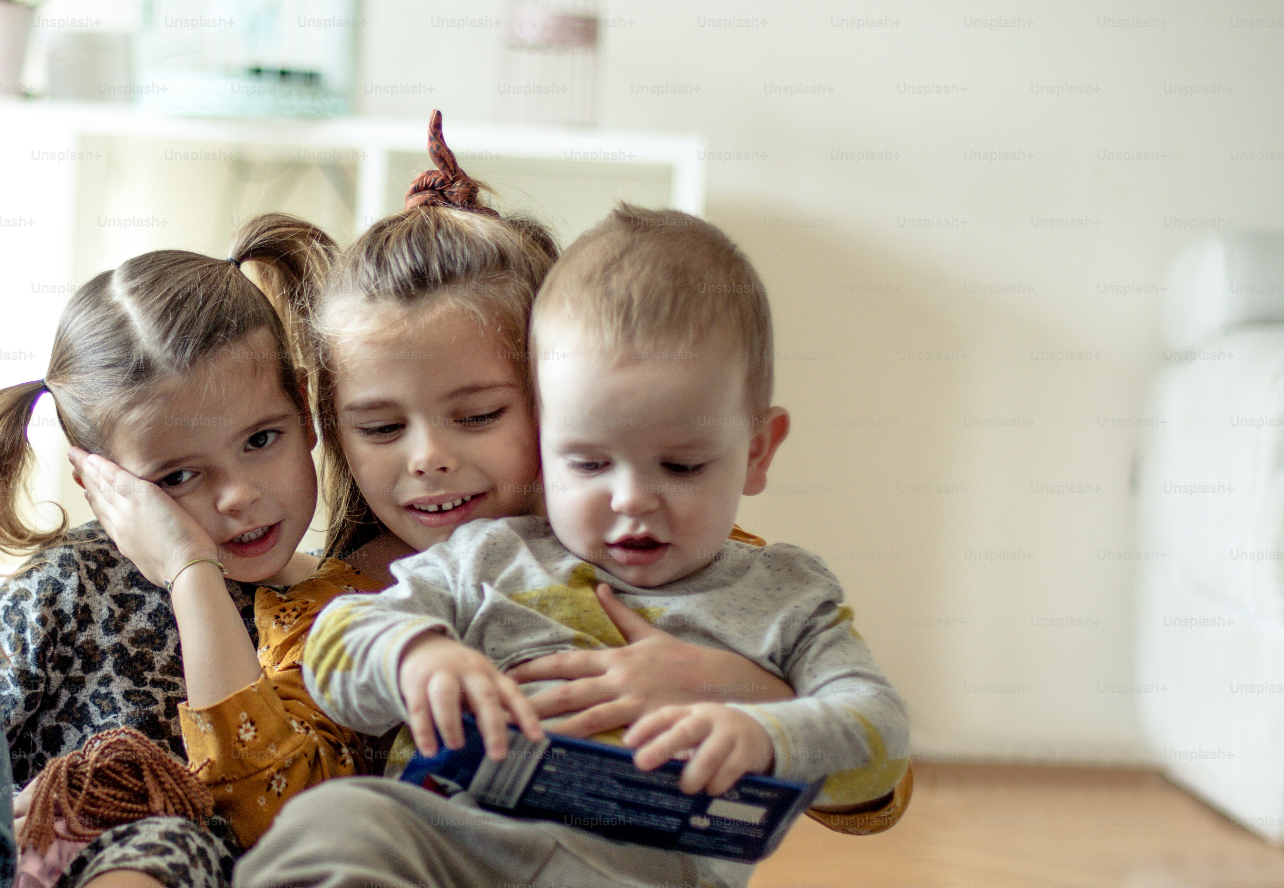 It's nice when you share everything you have. Three little children at home together.