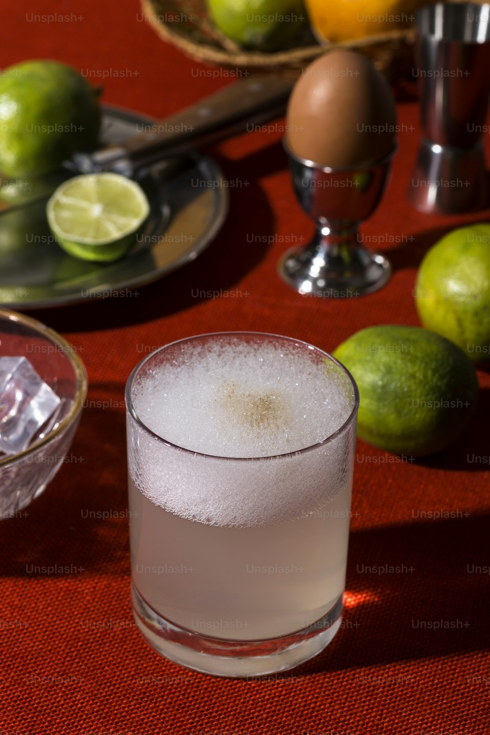 Pisco Sour, a cocktail with Pisco, lime or lemon juice, egg white, and angostura bitter in pop contemporary style.
