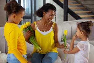 Sharing with you. Shy brunette girl standing in semi position and looking at her mom