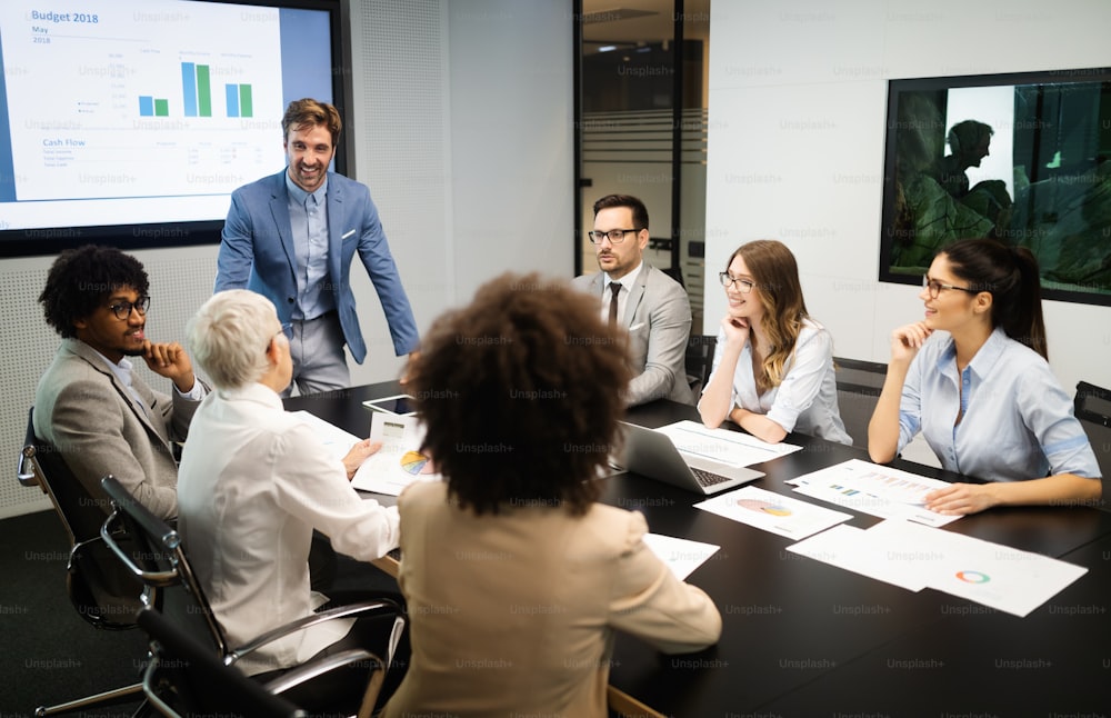 Business colleagues in conference meeting room during presentation