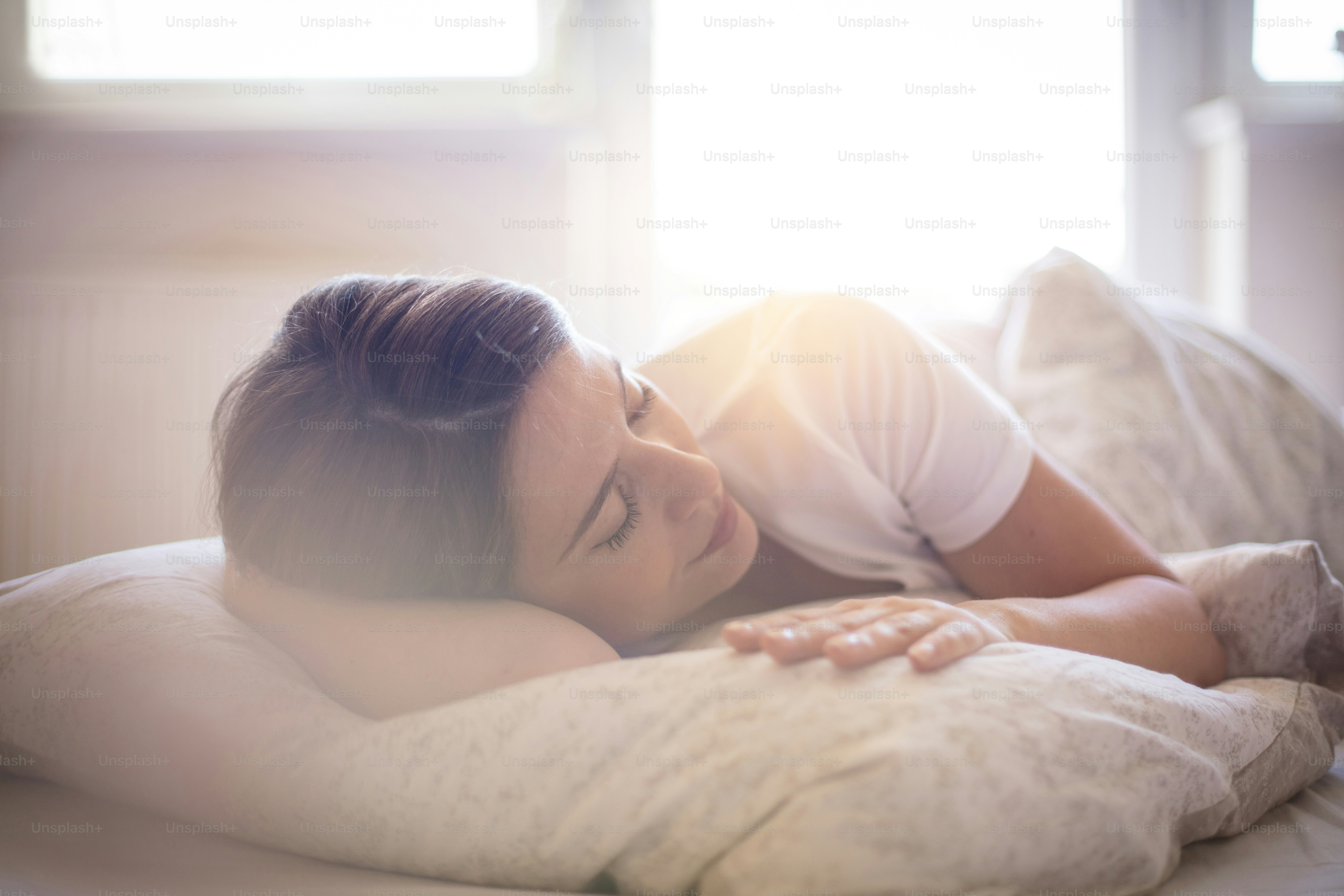 The most beautiful is the comfort of your bed. Woman sleeping in bed.