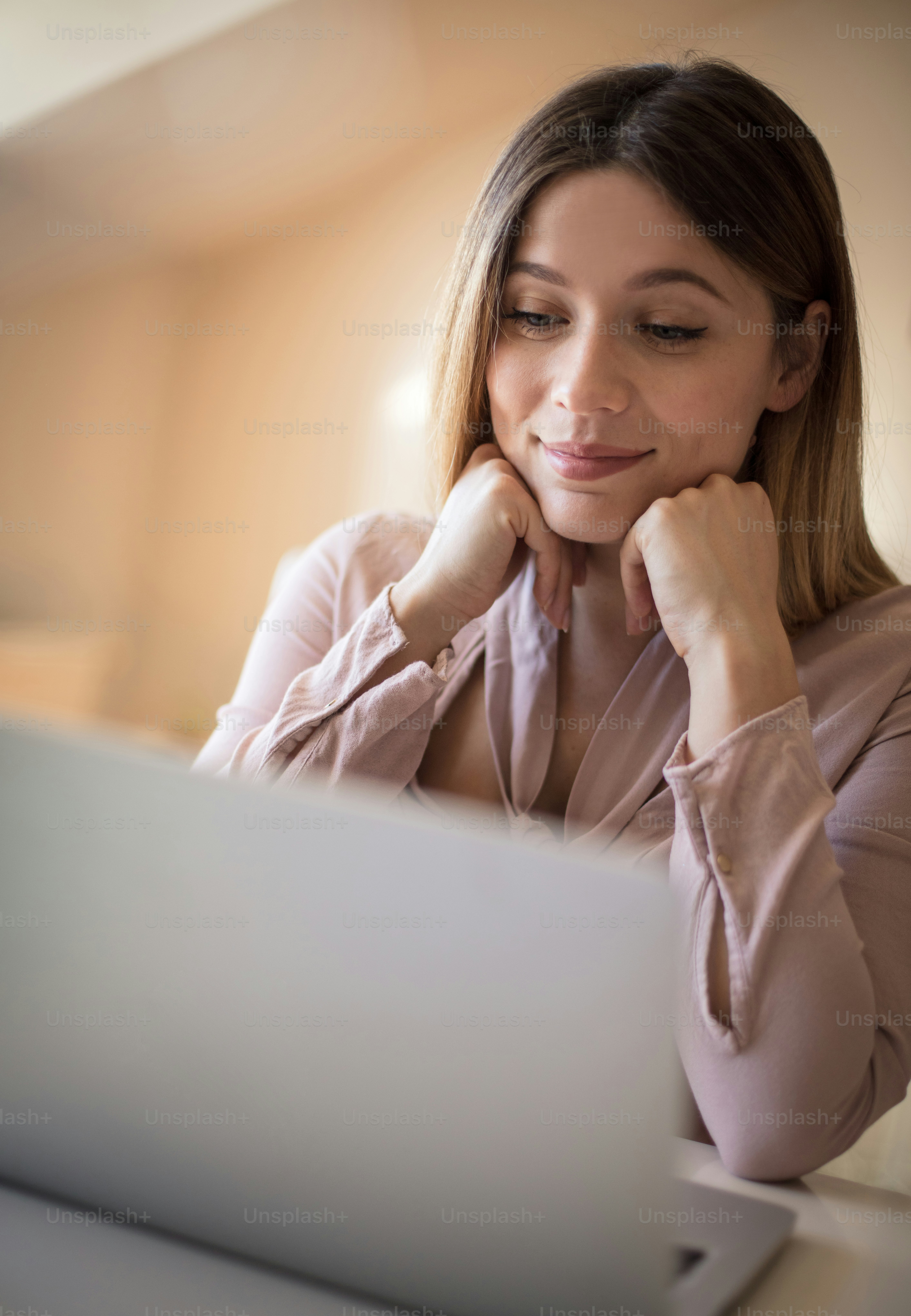 Waiting for an important email. Business woman working on laptop. photo
