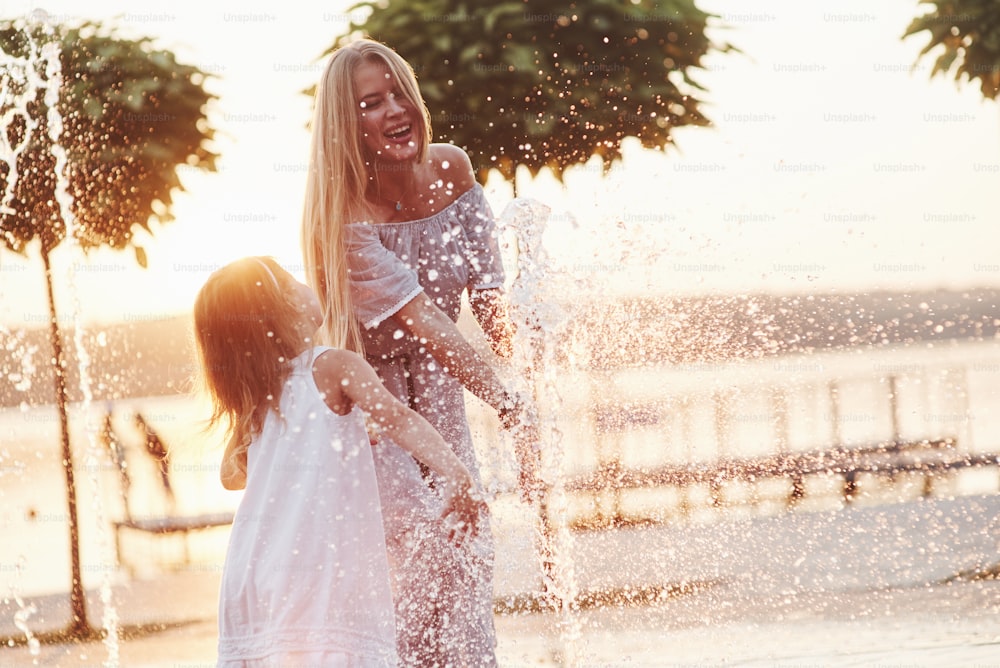 It's became to a totally mess and it's awesome. In a hot sunny day mother and her daughter decide to use fountain for cooling themselves and have fun with it.