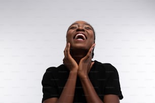 Woman laughing. Beaming African-American woman laughing out loud while feeling cheerful