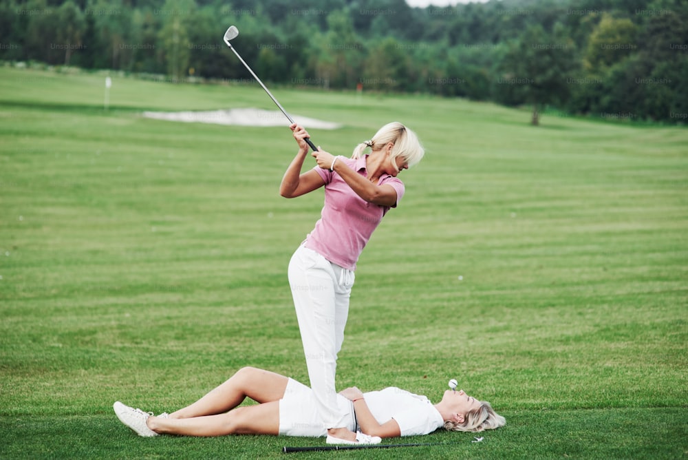Two women decides to play the golf a little bit another way. Try this is at your own risk.