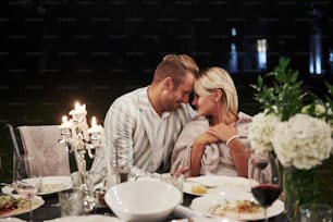 Beautiful adult couple have a luxury dinner at evening time.